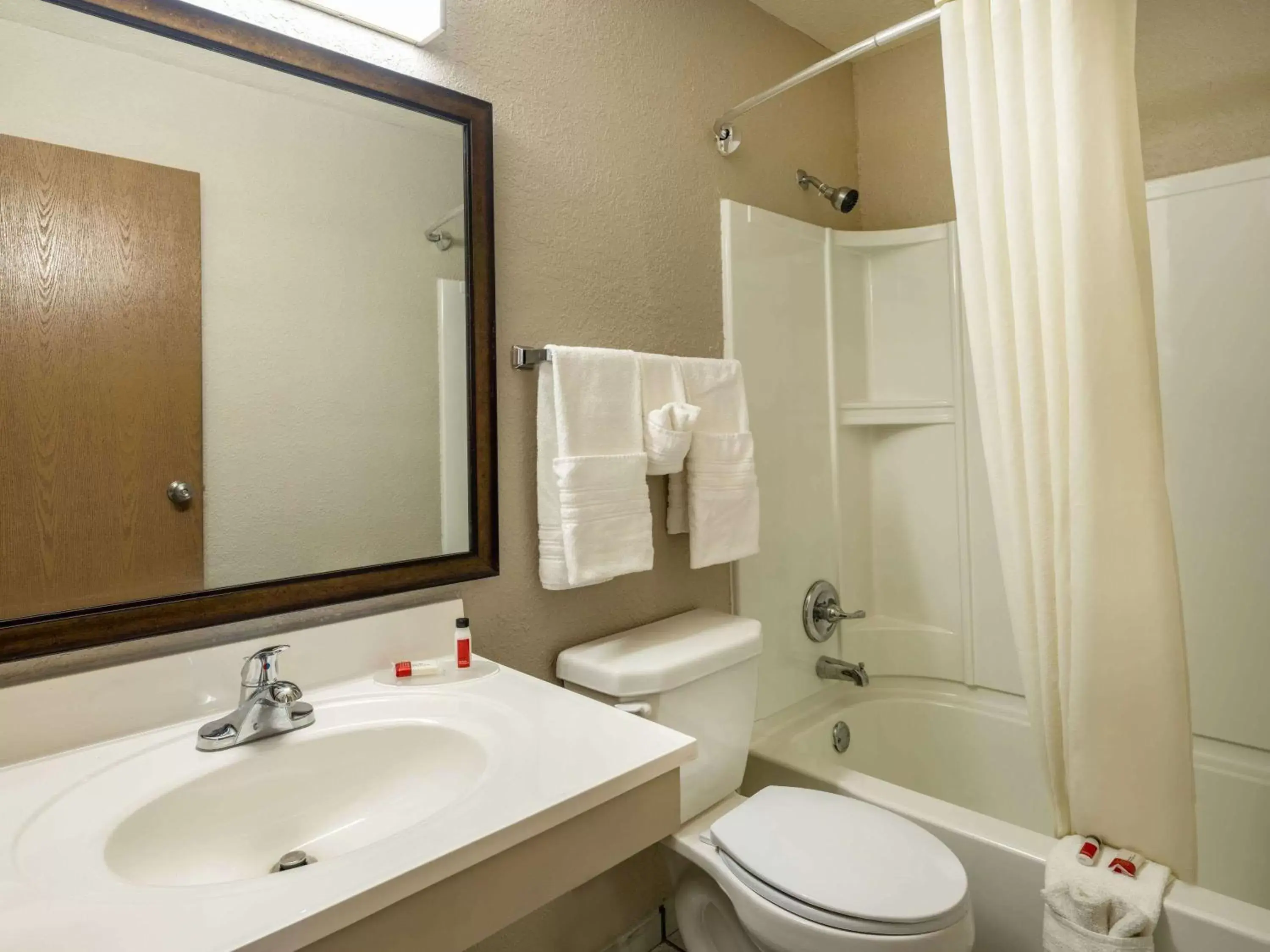 Bathroom in Super 8 by Wyndham Clinton