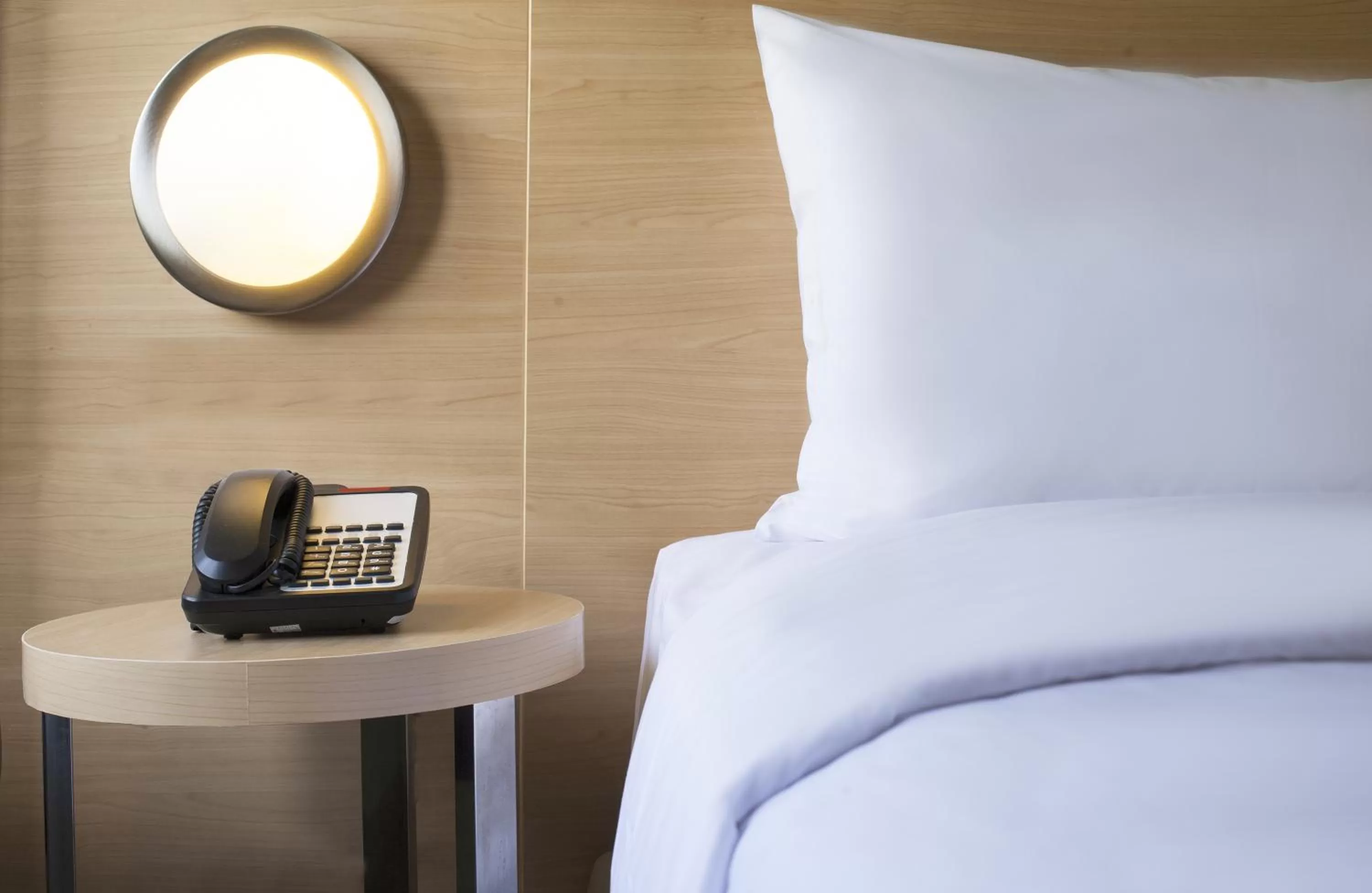 Bed in Zest Yogyakarta by Swiss-Belhotel International