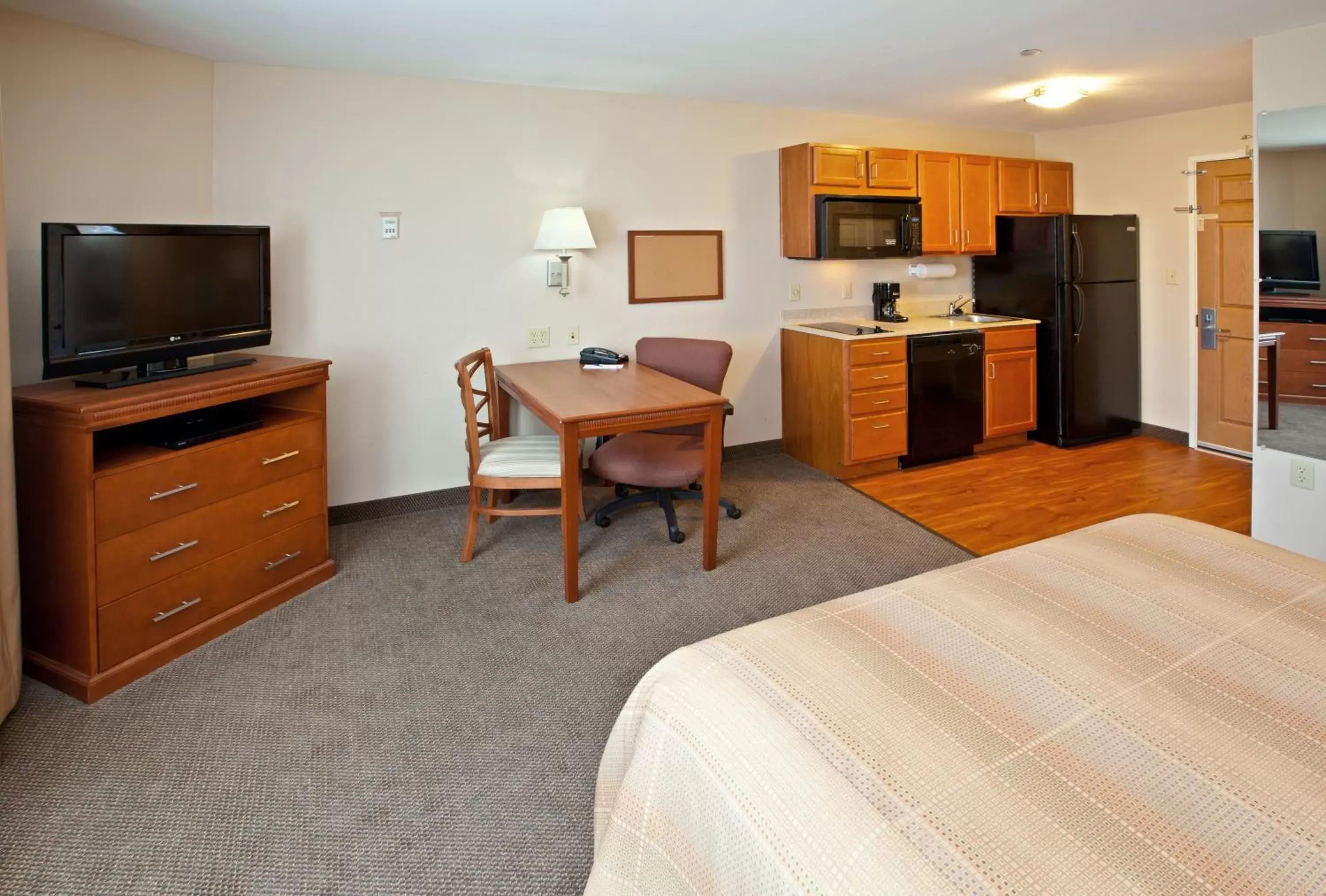 Photo of the whole room, TV/Entertainment Center in Candlewood Suites Louisville North, an IHG Hotel