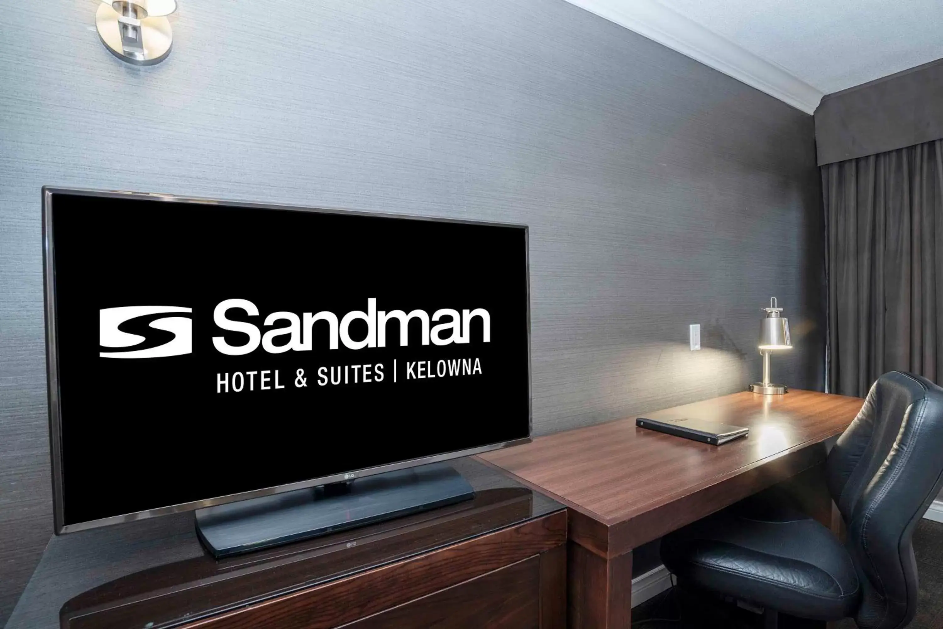 Photo of the whole room, TV/Entertainment Center in Sandman Hotel & Suites Kelowna