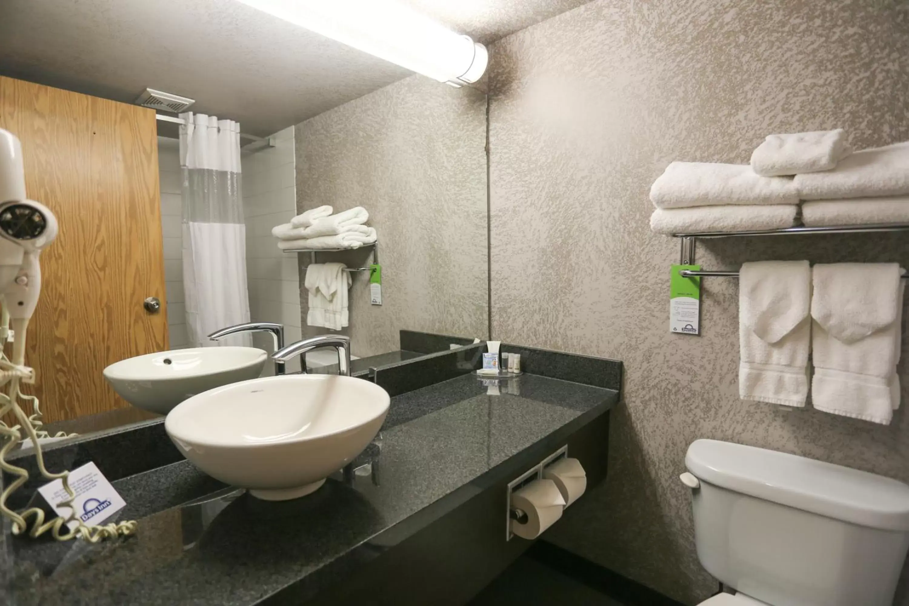 Bathroom in Days Inn by Wyndham Calgary Airport