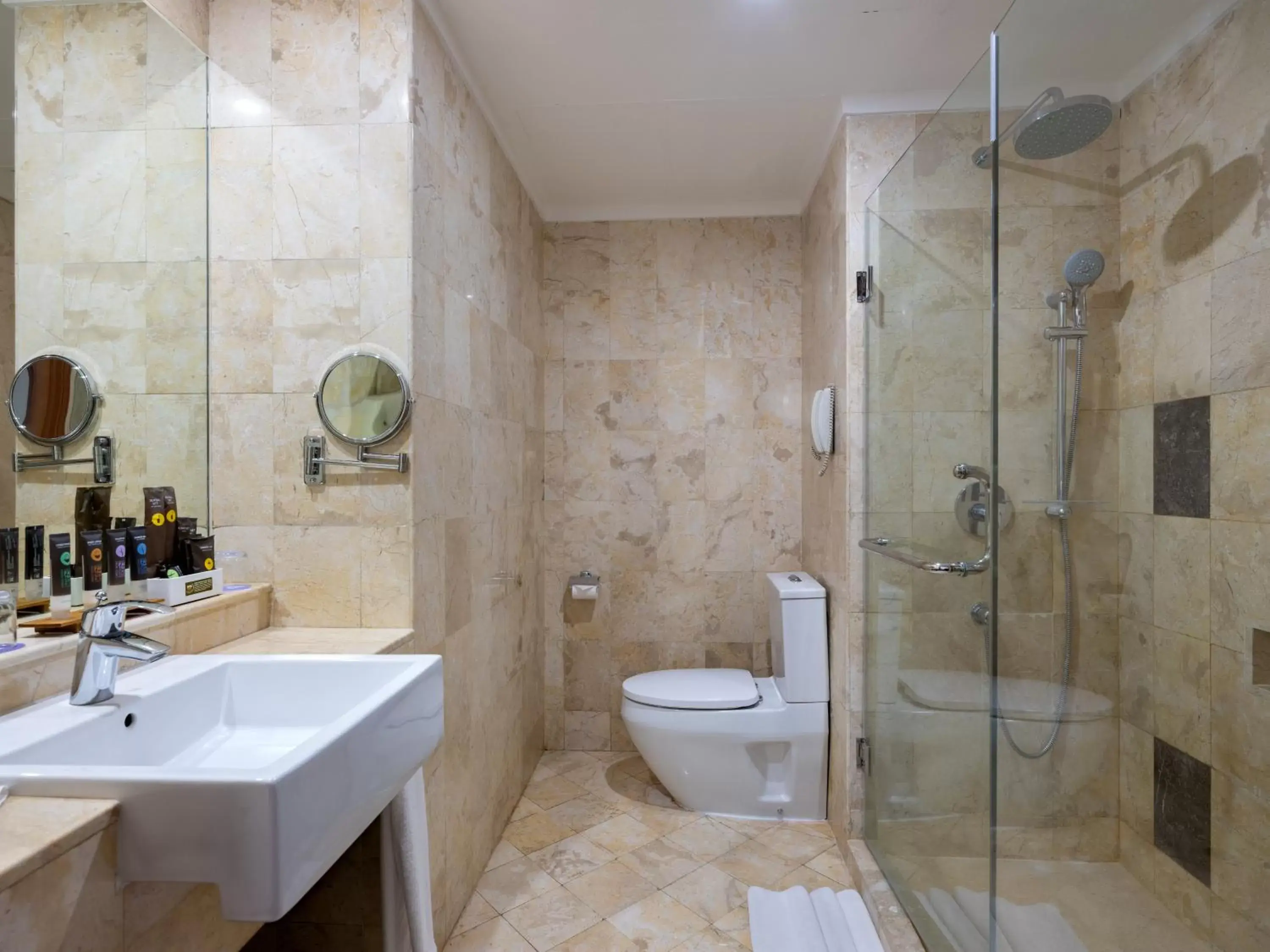 Bathroom in Kimaya Sudirman Yogyakarta by Harris