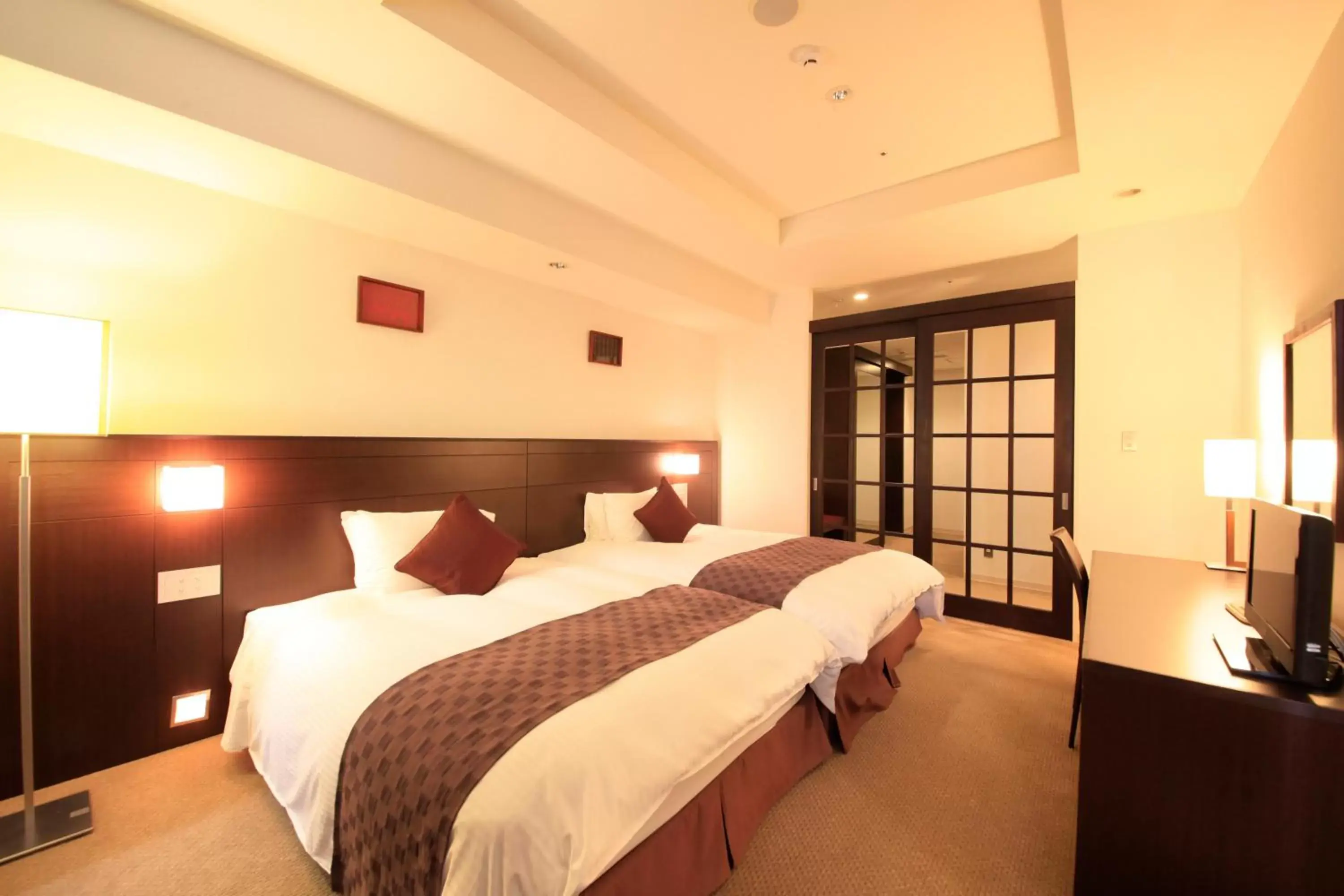 Photo of the whole room, Bed in Quintessa Hotel Sasebo