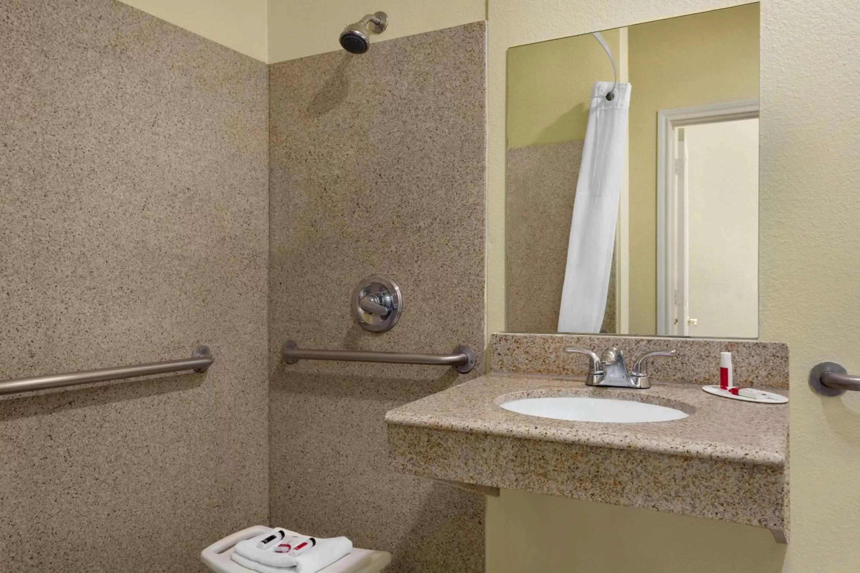 Bathroom in Days Inn & Suites by Wyndham DFW Airport South-Euless