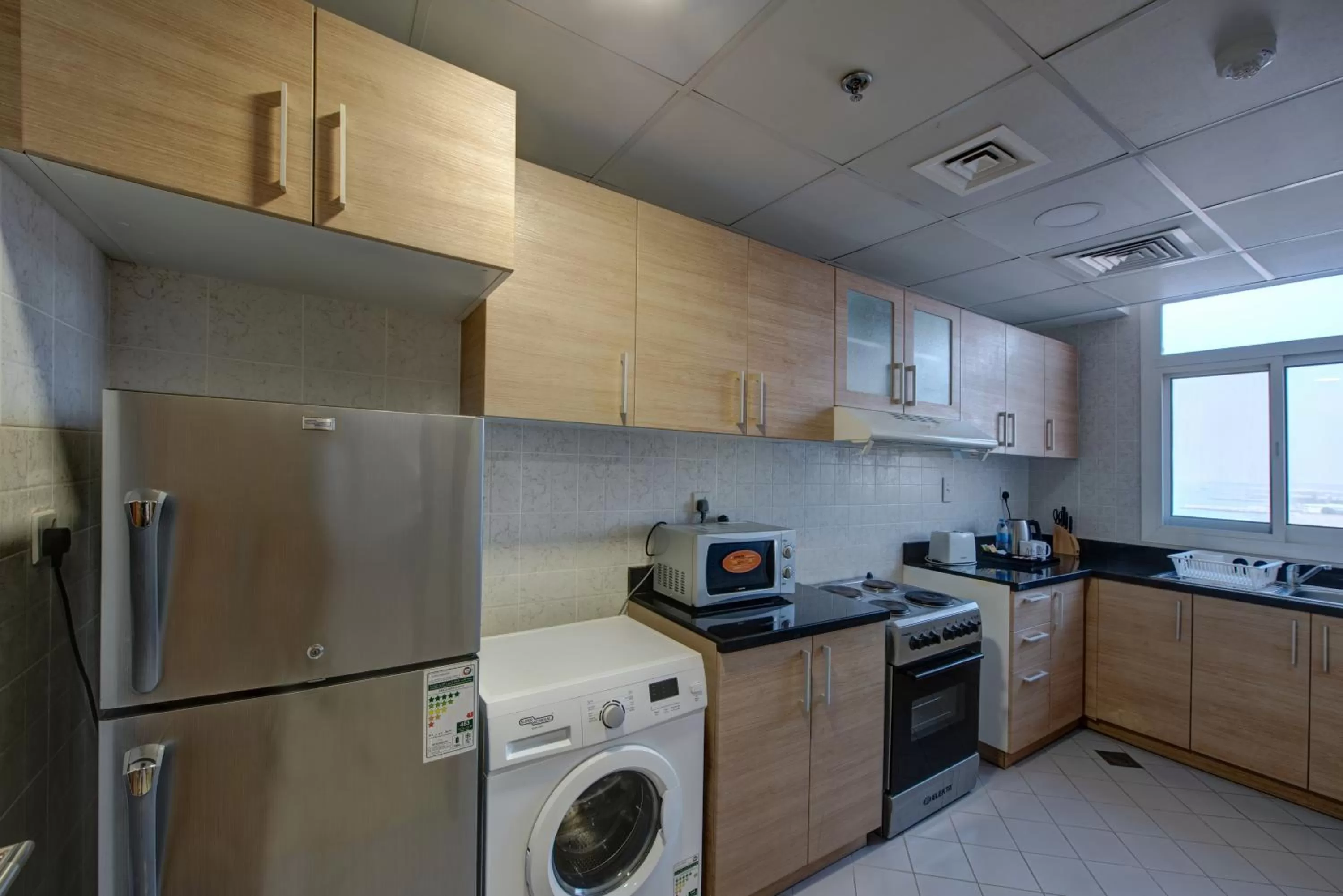 Kitchen or kitchenette in City Stay Beach Hotel Apartments - Marjan Island