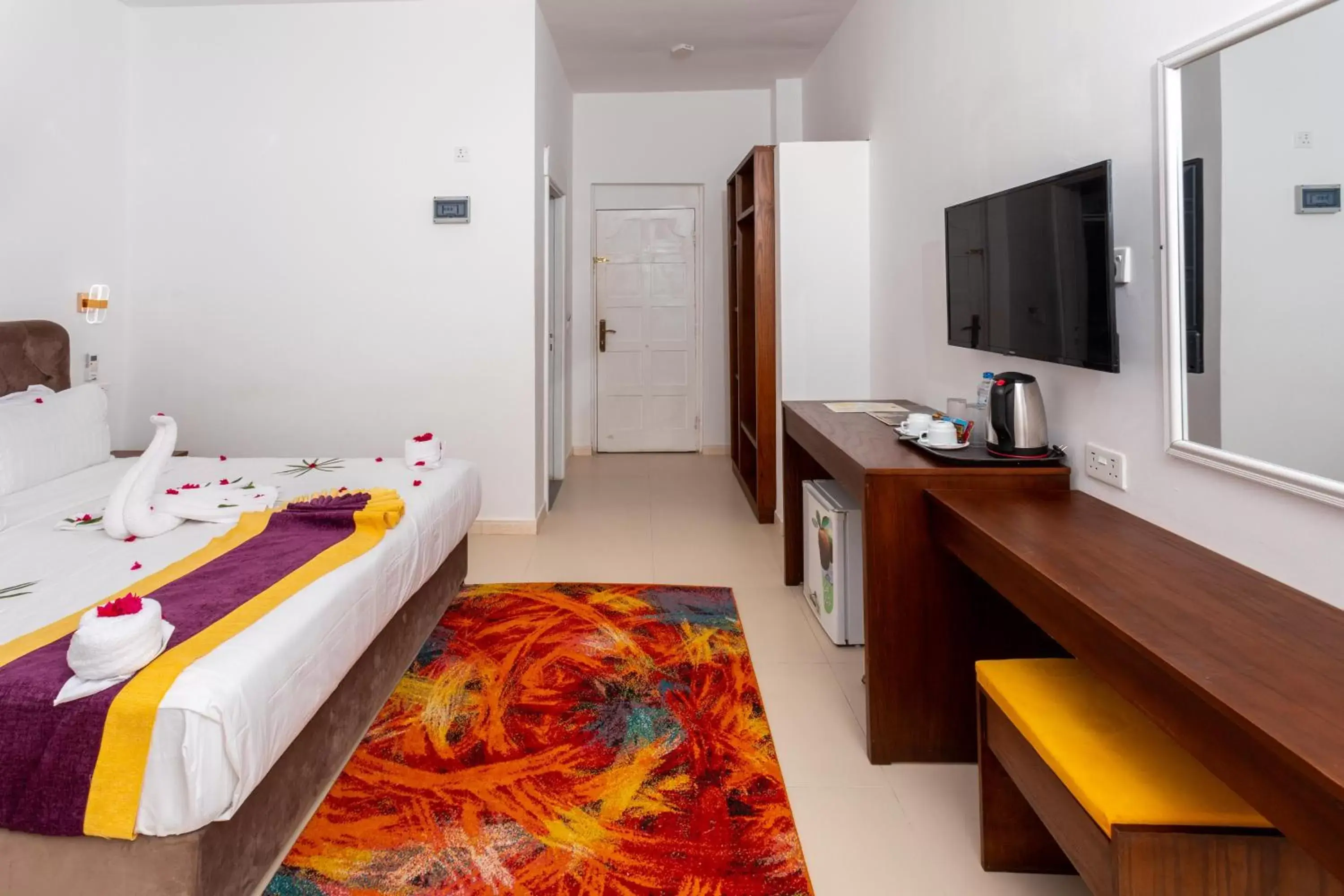 Bedroom, TV/Entertainment Center in Canary Nungwi Hotel & Free SPA Bedroom, TV/Entertainment Center in Canary Nungwi Hotel & Free SPA