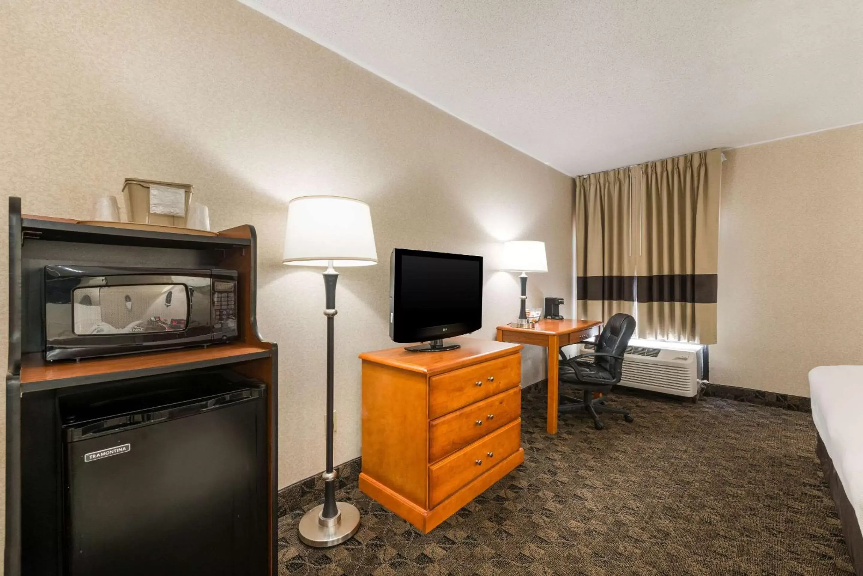 Photo of the whole room, TV/Entertainment Center in Quality Inn & Suites