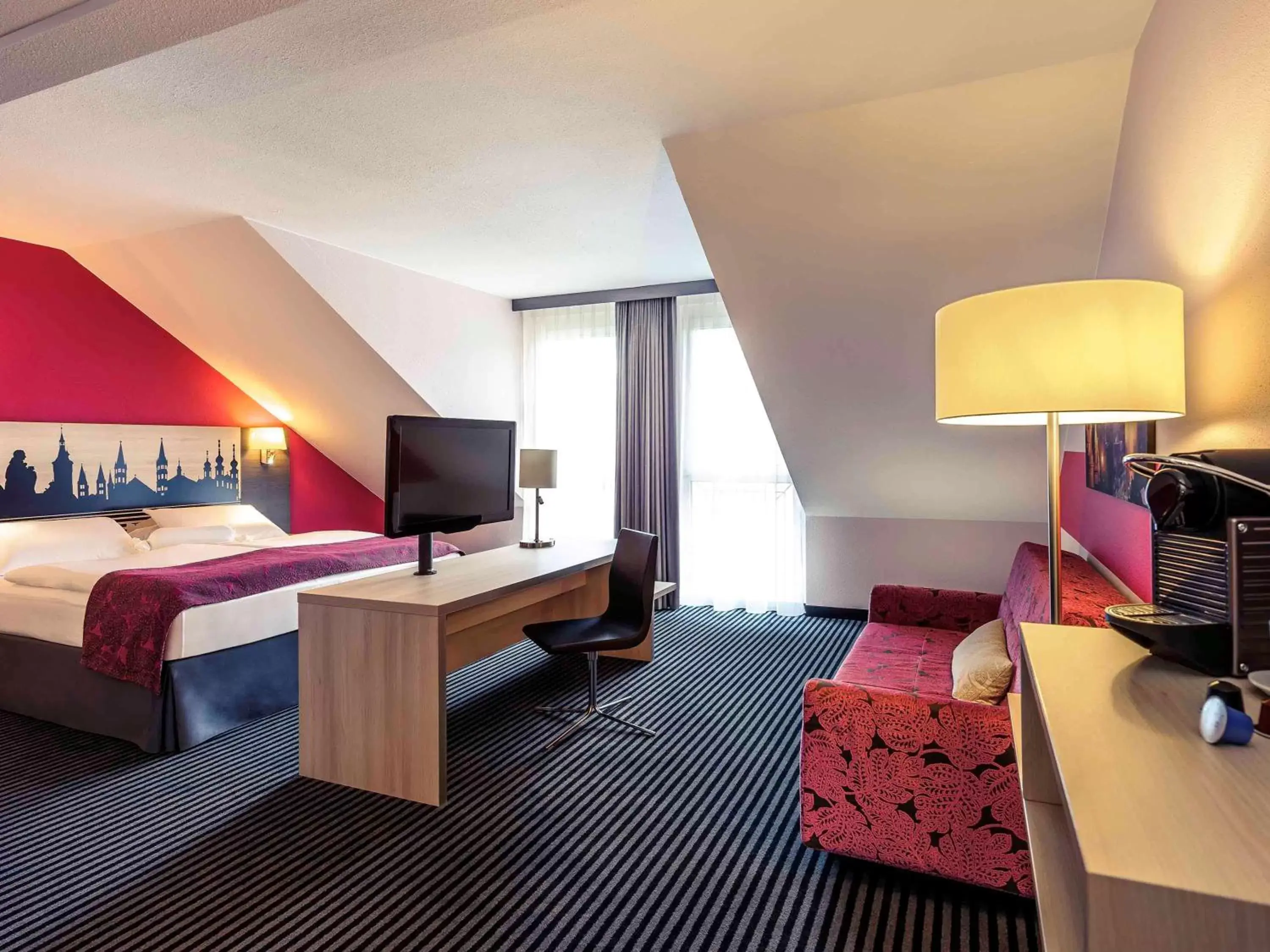 Photo of the whole room, TV/Entertainment Center in Mercure Hotel Würzburg am Mainufer