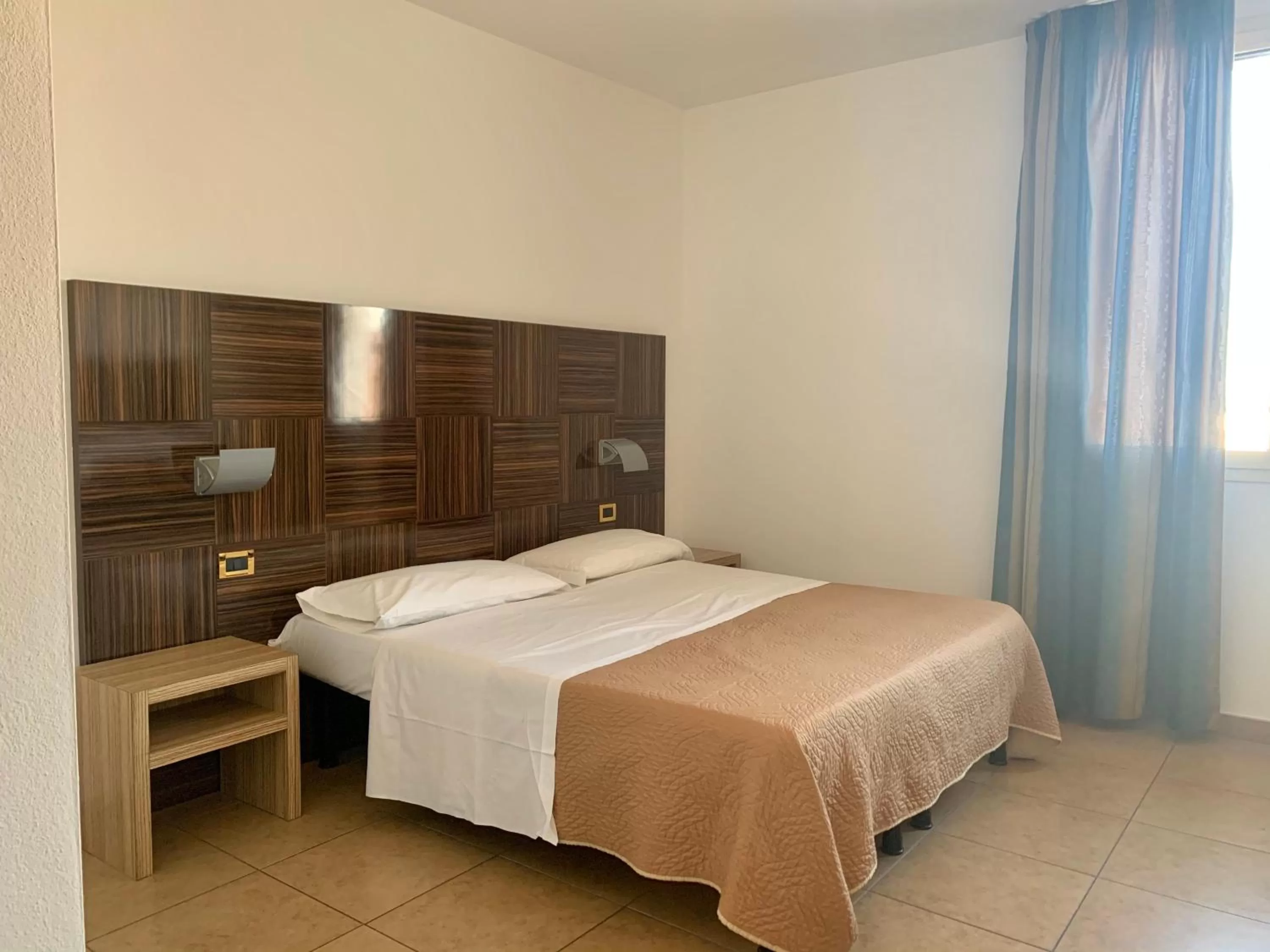 Bed in Hotel Riverside