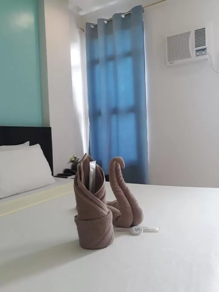 Bed in Coron Visitors Hotel