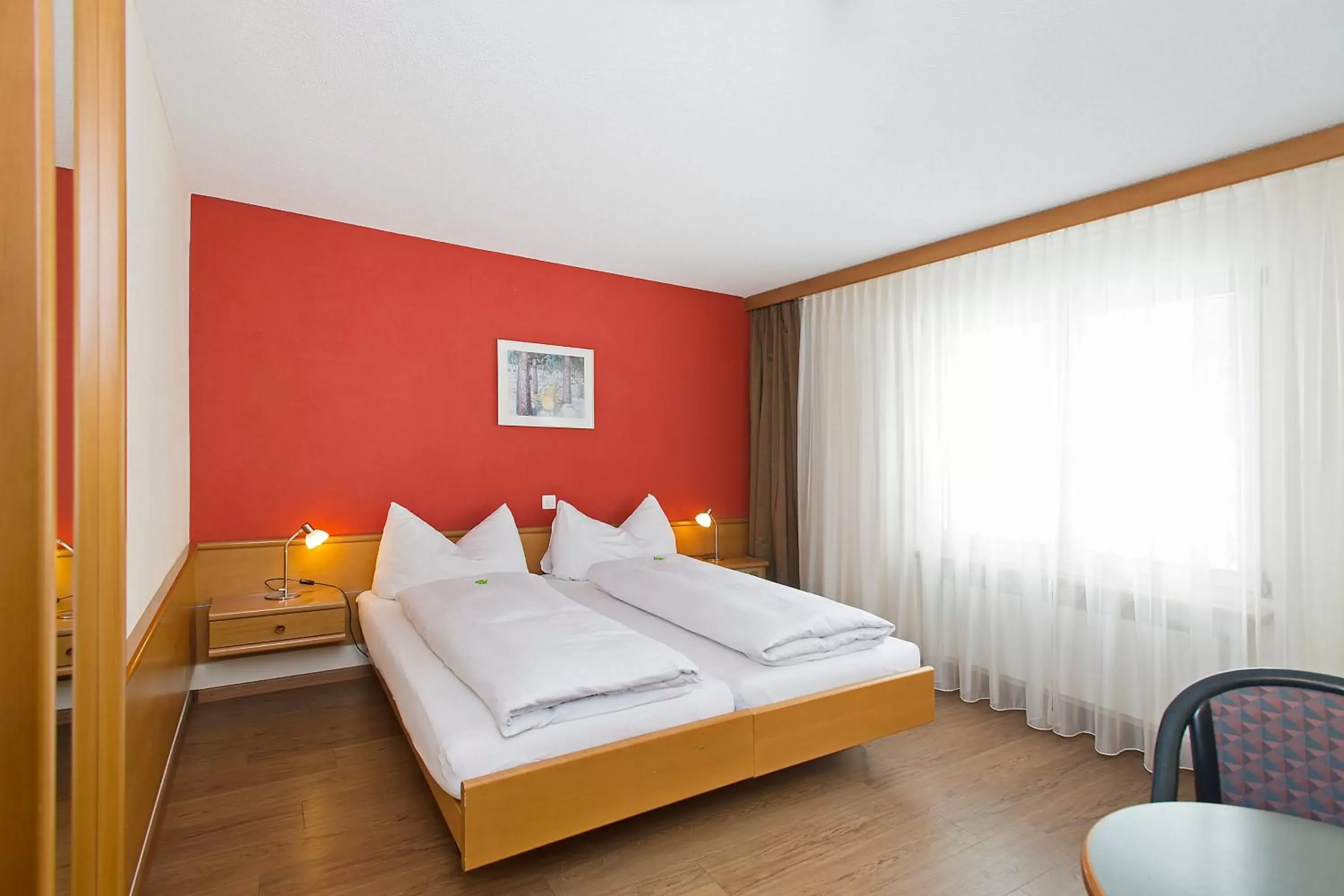 Photo of the whole room, Bed in Hotel Sportcenter Fünf Dörfer AG