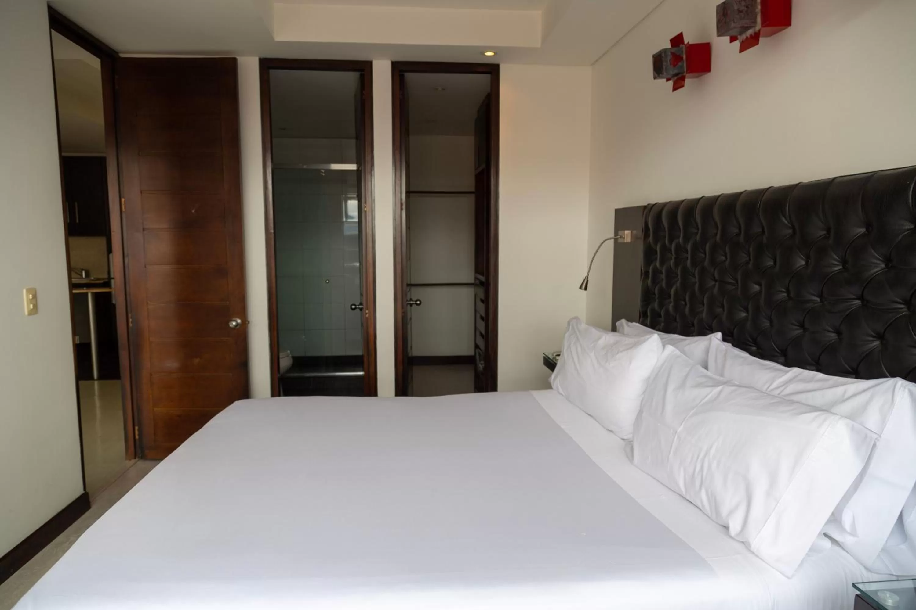 Bed in Hotel 104 Art Suites