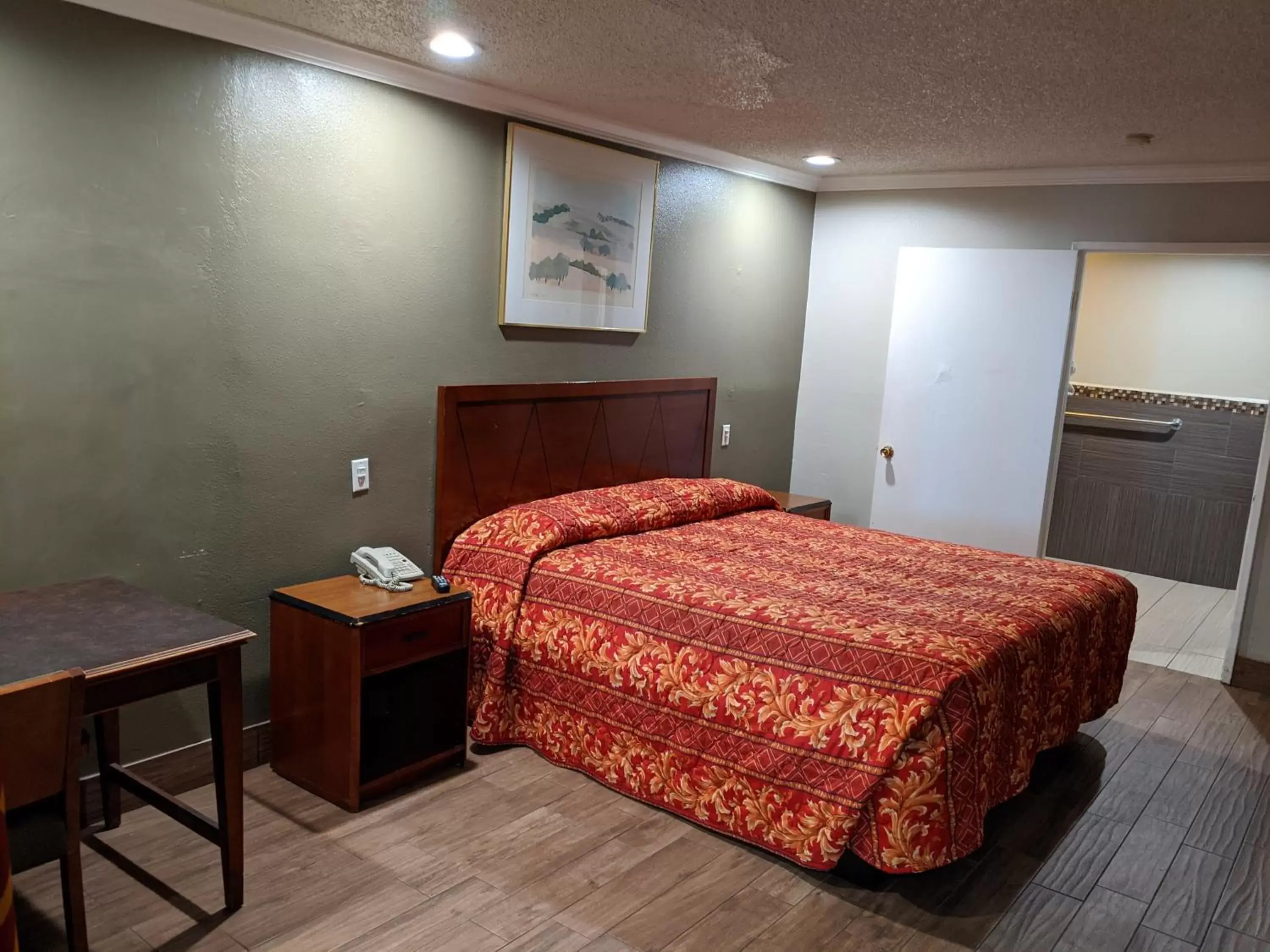 Bed in Passport Inn & Suites