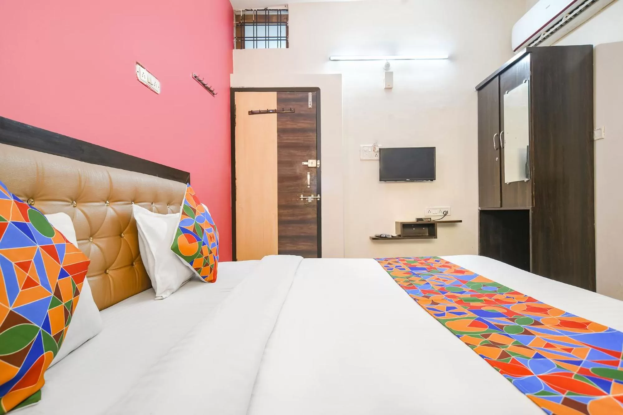 Bed in FabExpress Royal Palace Inn