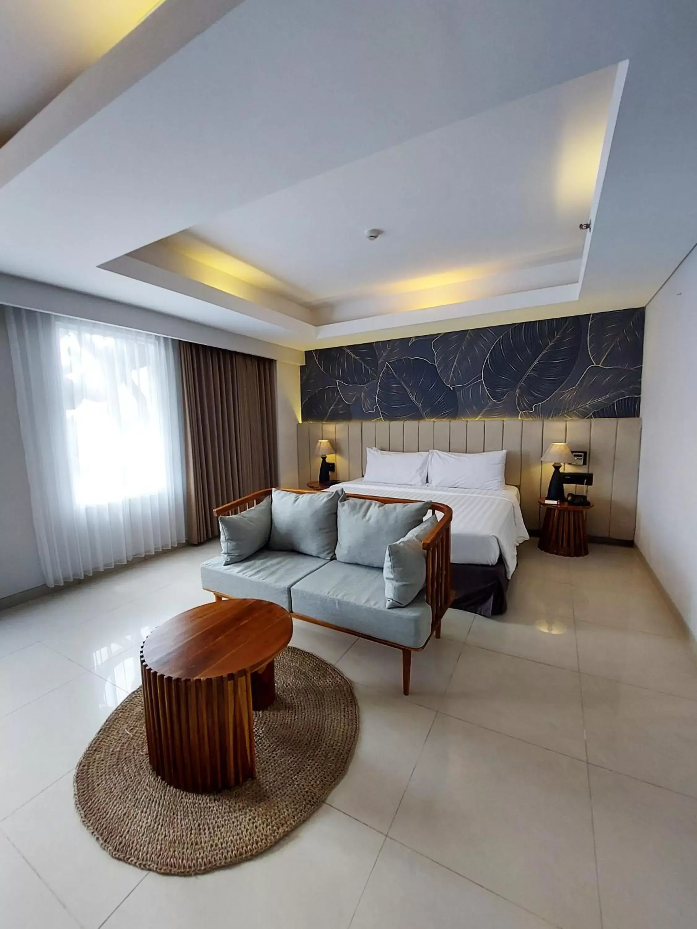 Bed, Seating Area in Crystalkuta Hotel - Bali