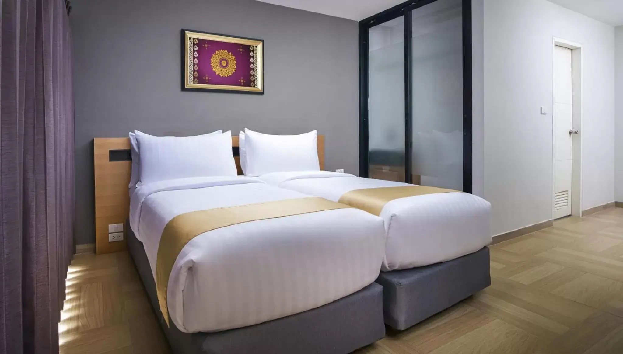 Bed in Chiva Bangkok Hotel - SHA Plus