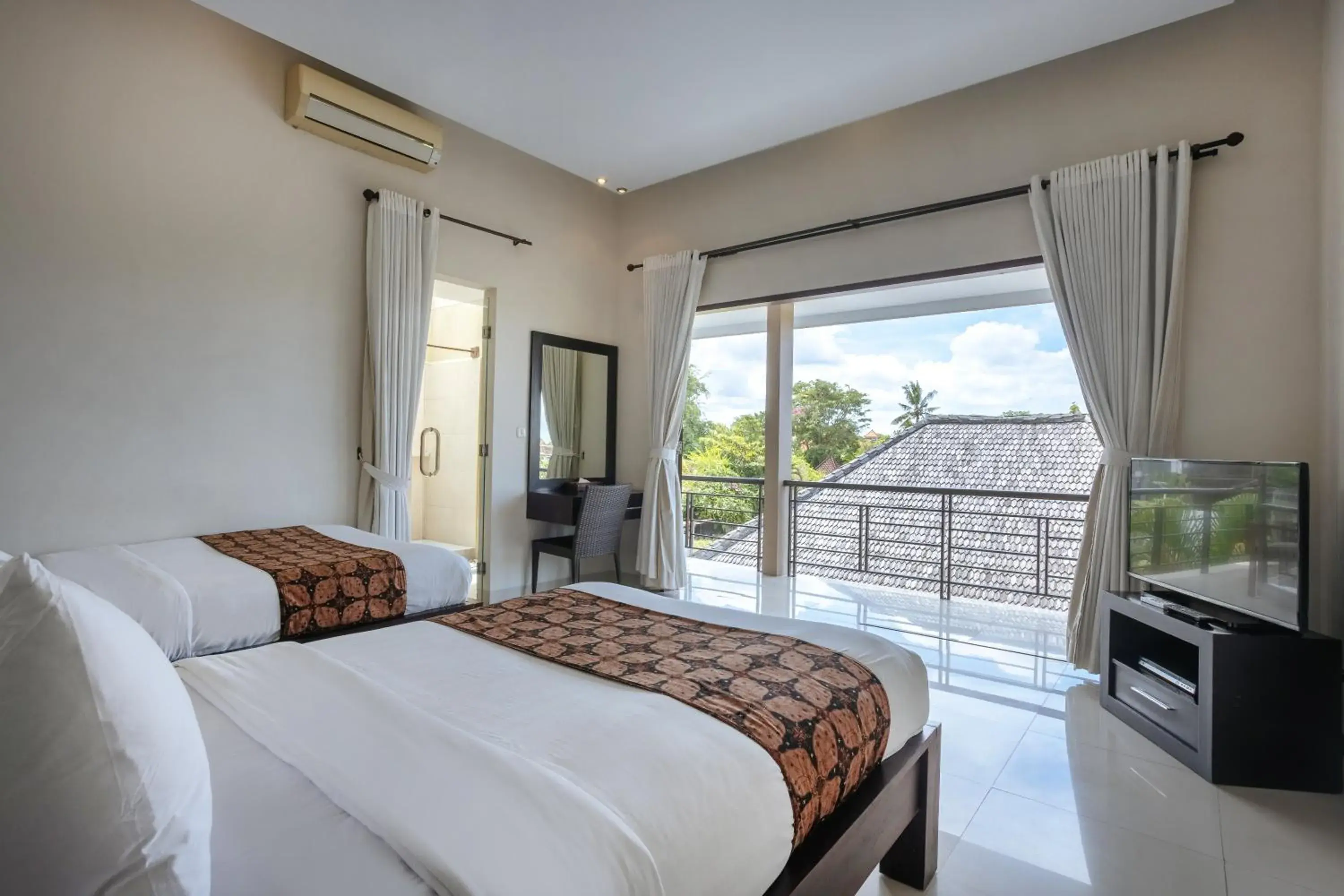 Bed in The Bidadari Villas and Spa