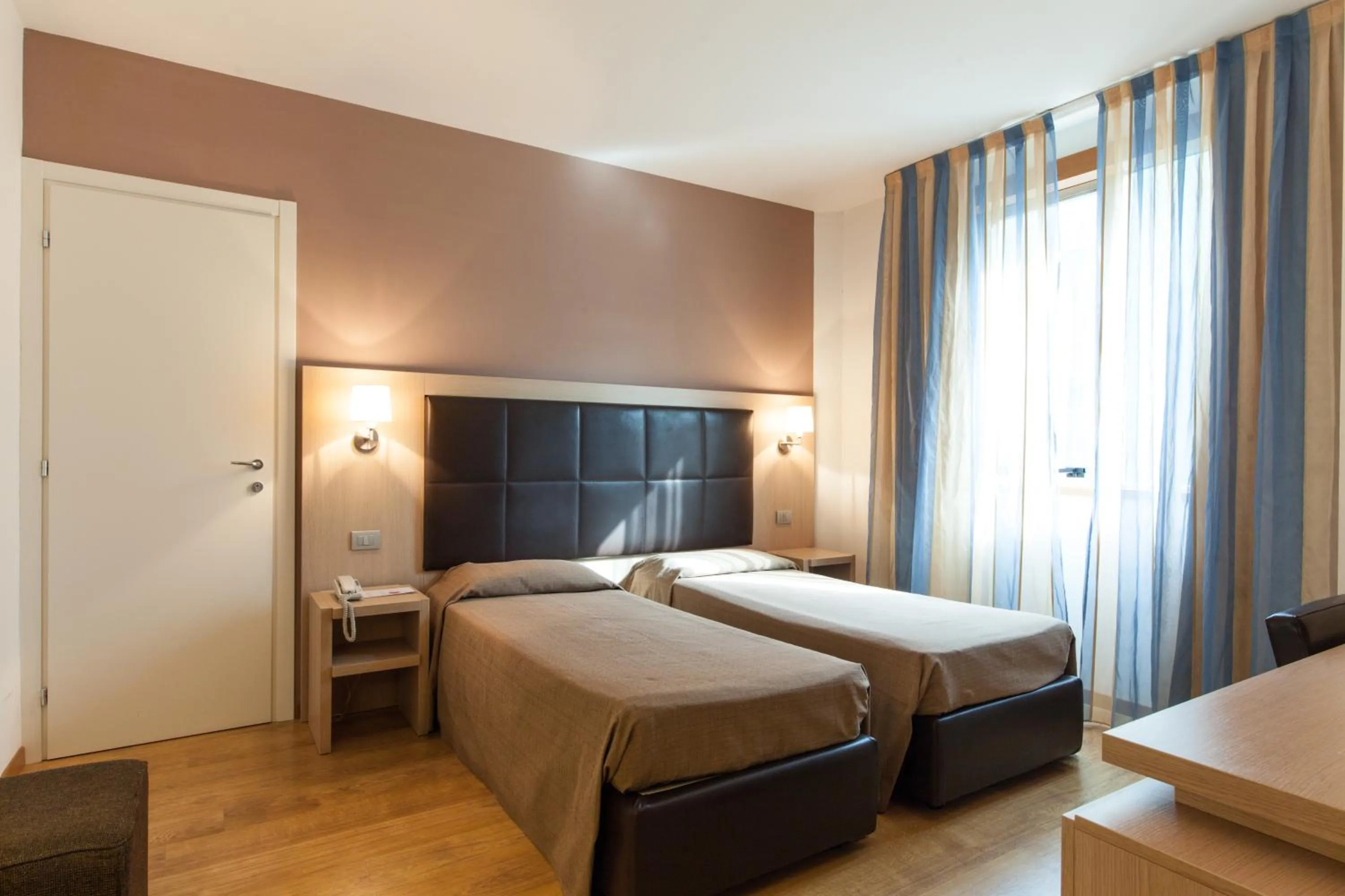 Bed in Hotel Michelangelo