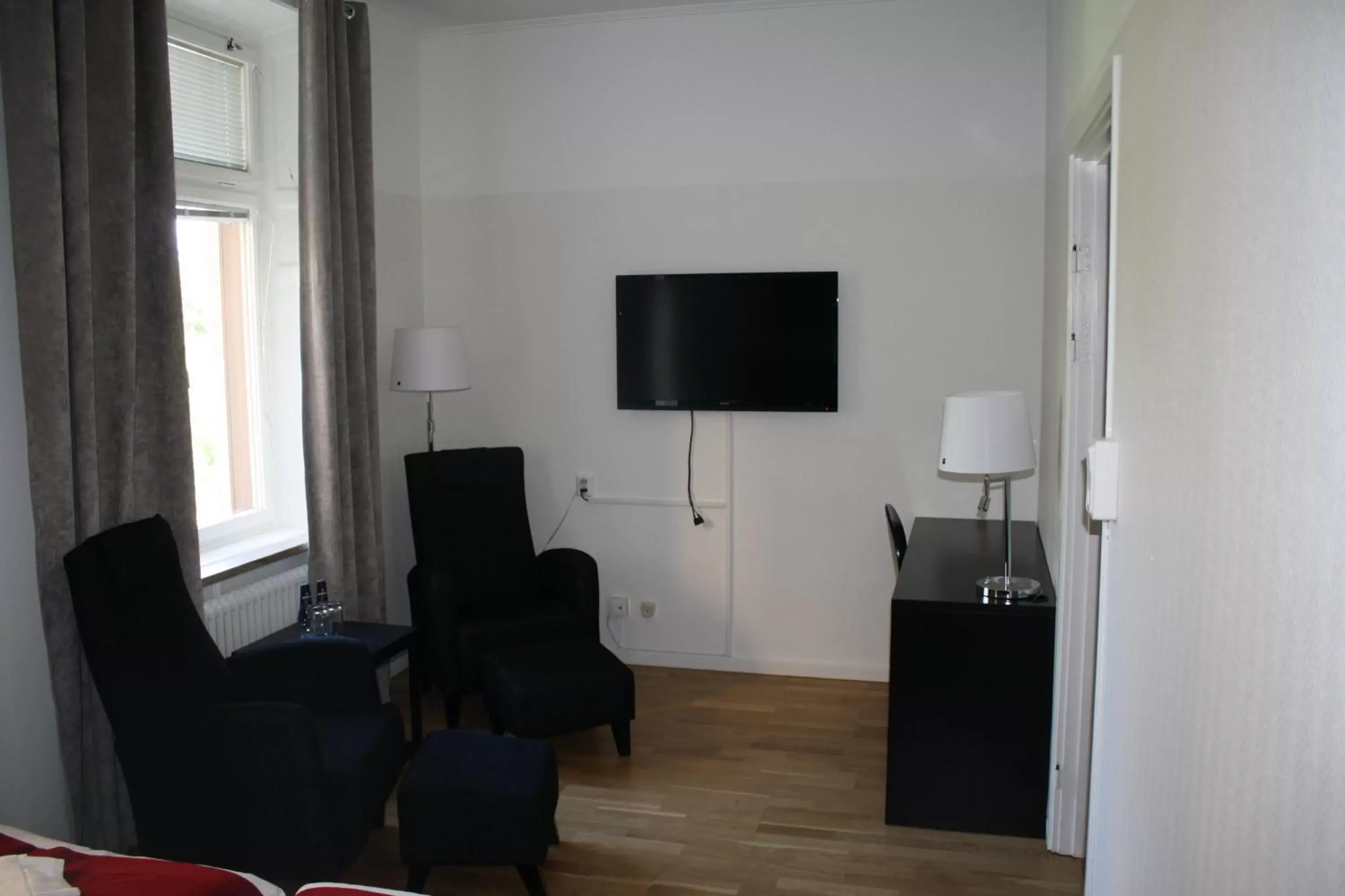 Seating area, TV/Entertainment Center in Stadshotellet Kristinehamn