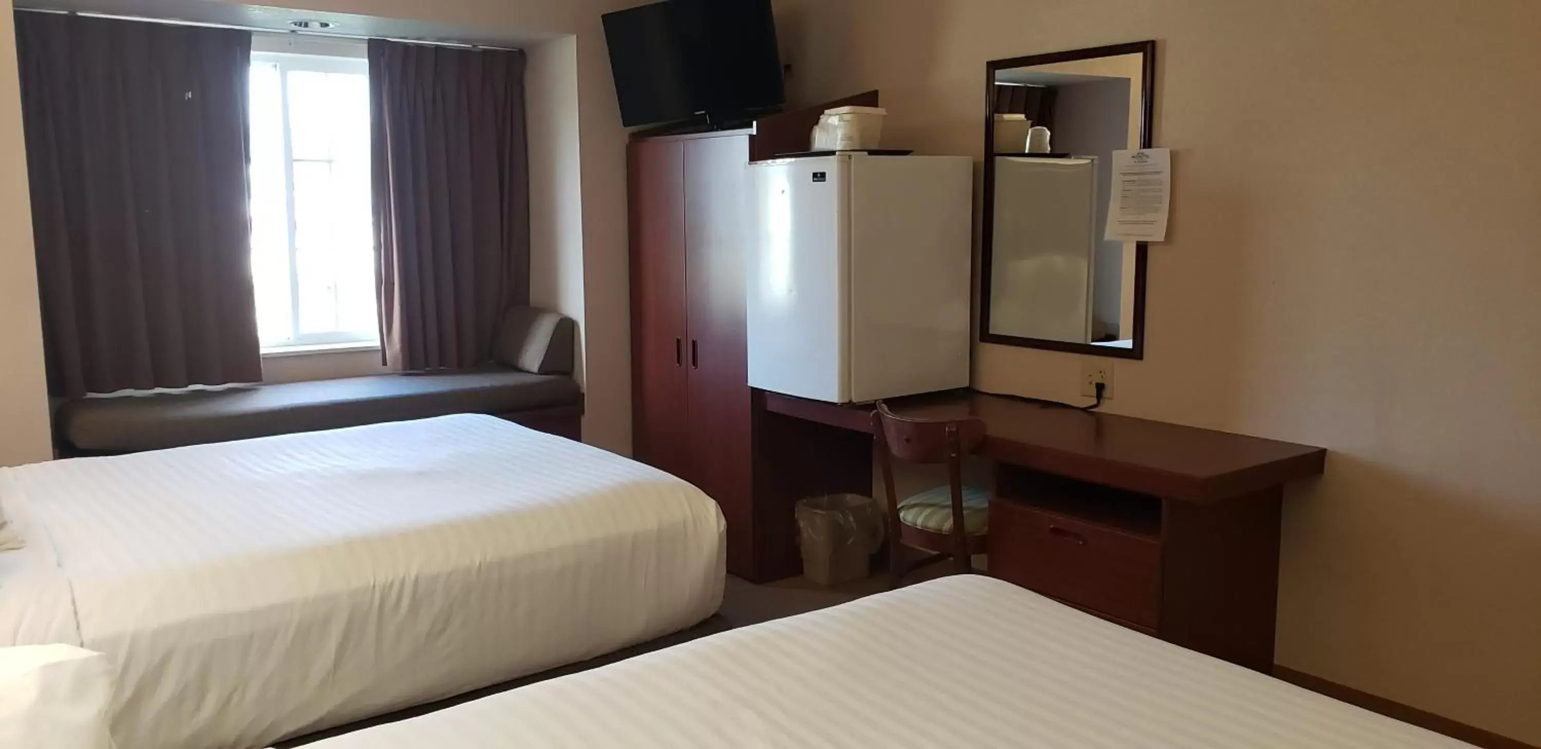 Bed in Microtel Inn & Suites by Wyndham Wellsville