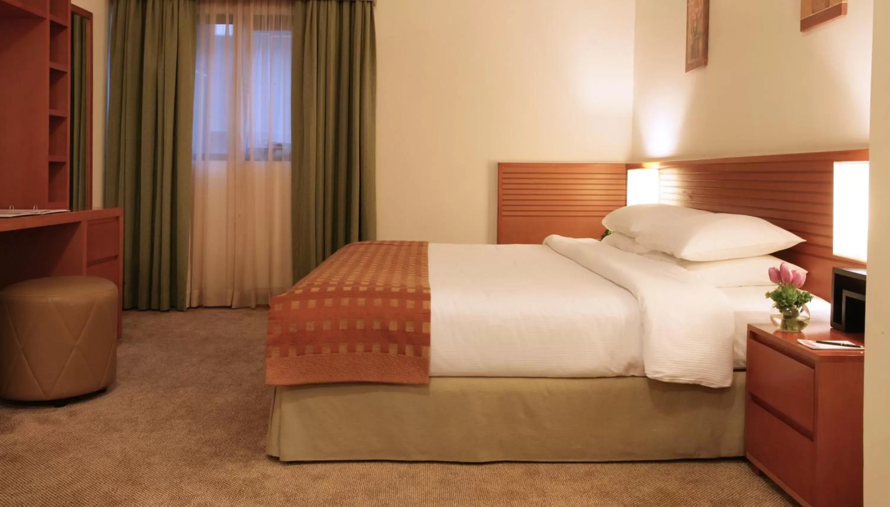 Bed in Ramada Hotel & Suites by Wyndham Ajman