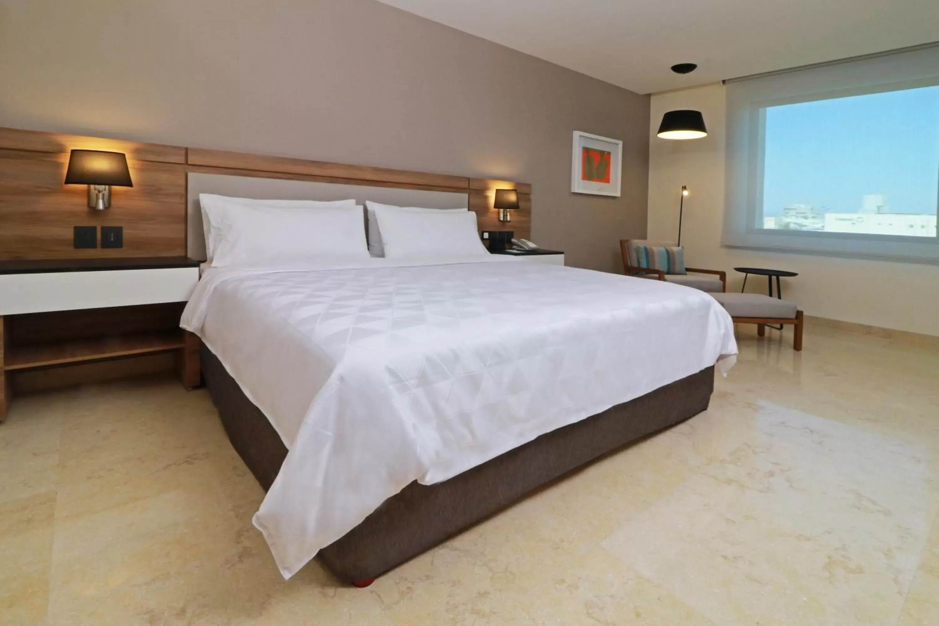 Photo of the whole room, Bed in Holiday Inn & Suites - Puerto Vallarta Marina & Golf, an IHG Hotel