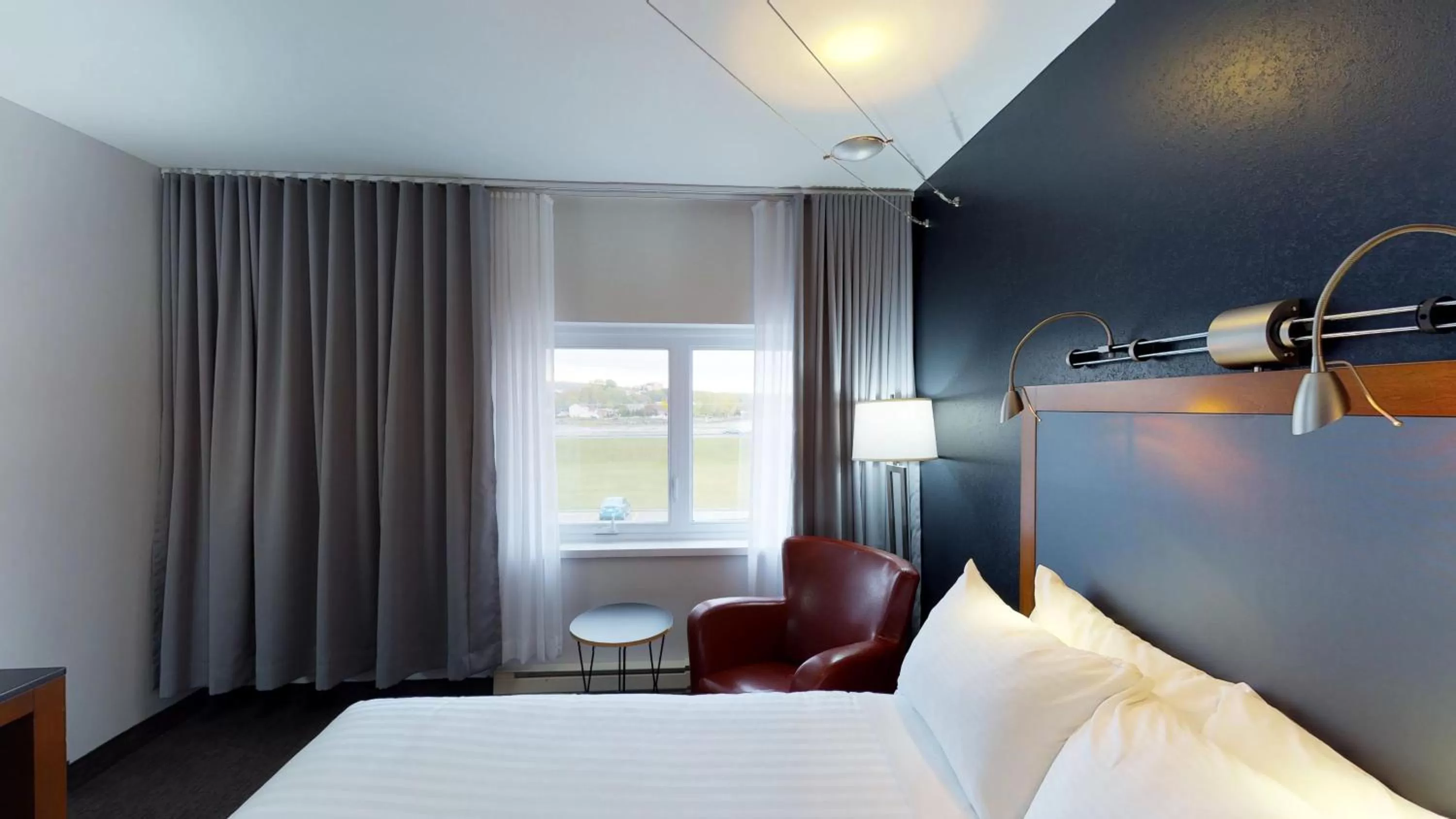 Photo of the whole room, Bed in Riotel Matane