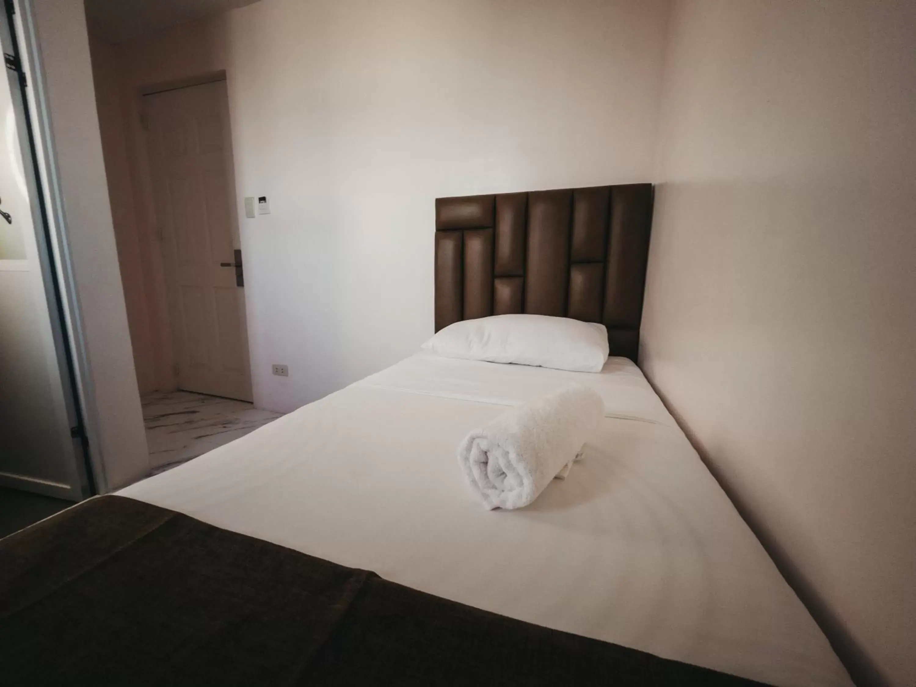 Bed in La Choeben Suites Bed in La Choeben Suites