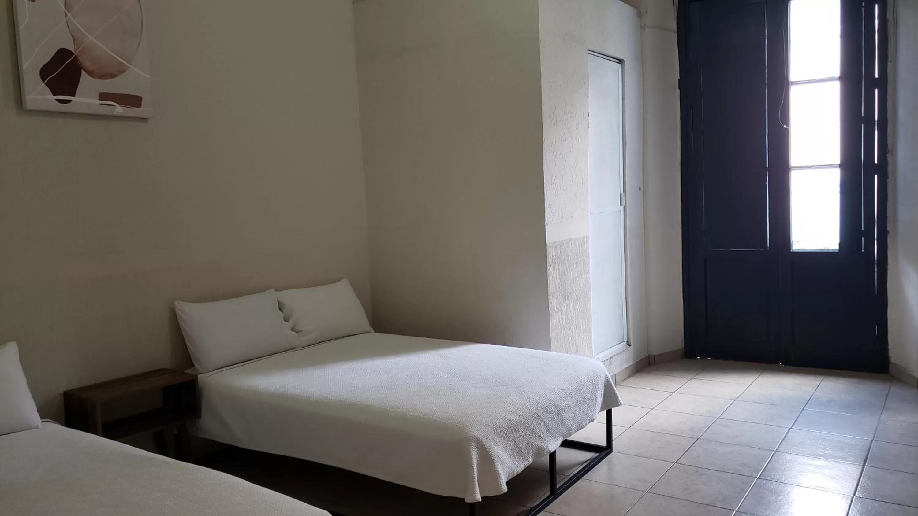 Bed in Hotel Grand Isitia