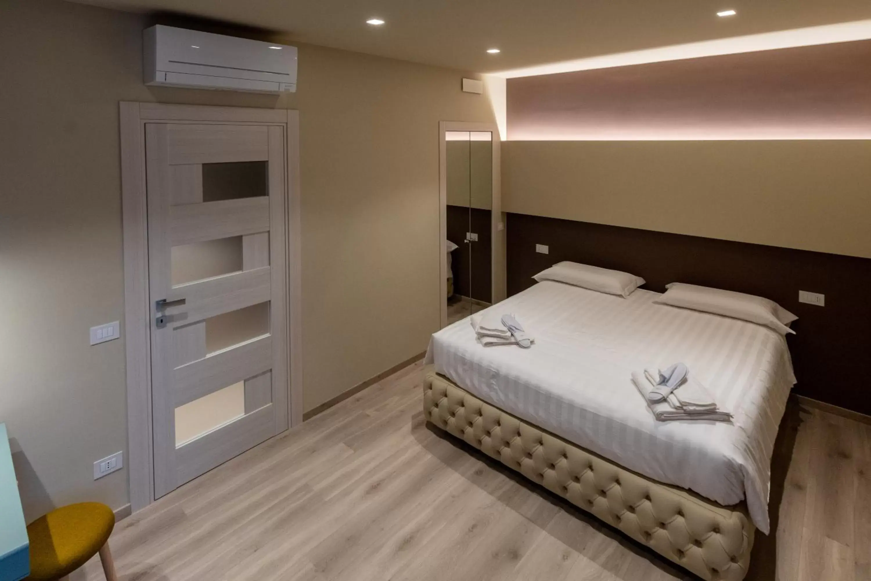 Bed in DiVino Rooms Deluxe