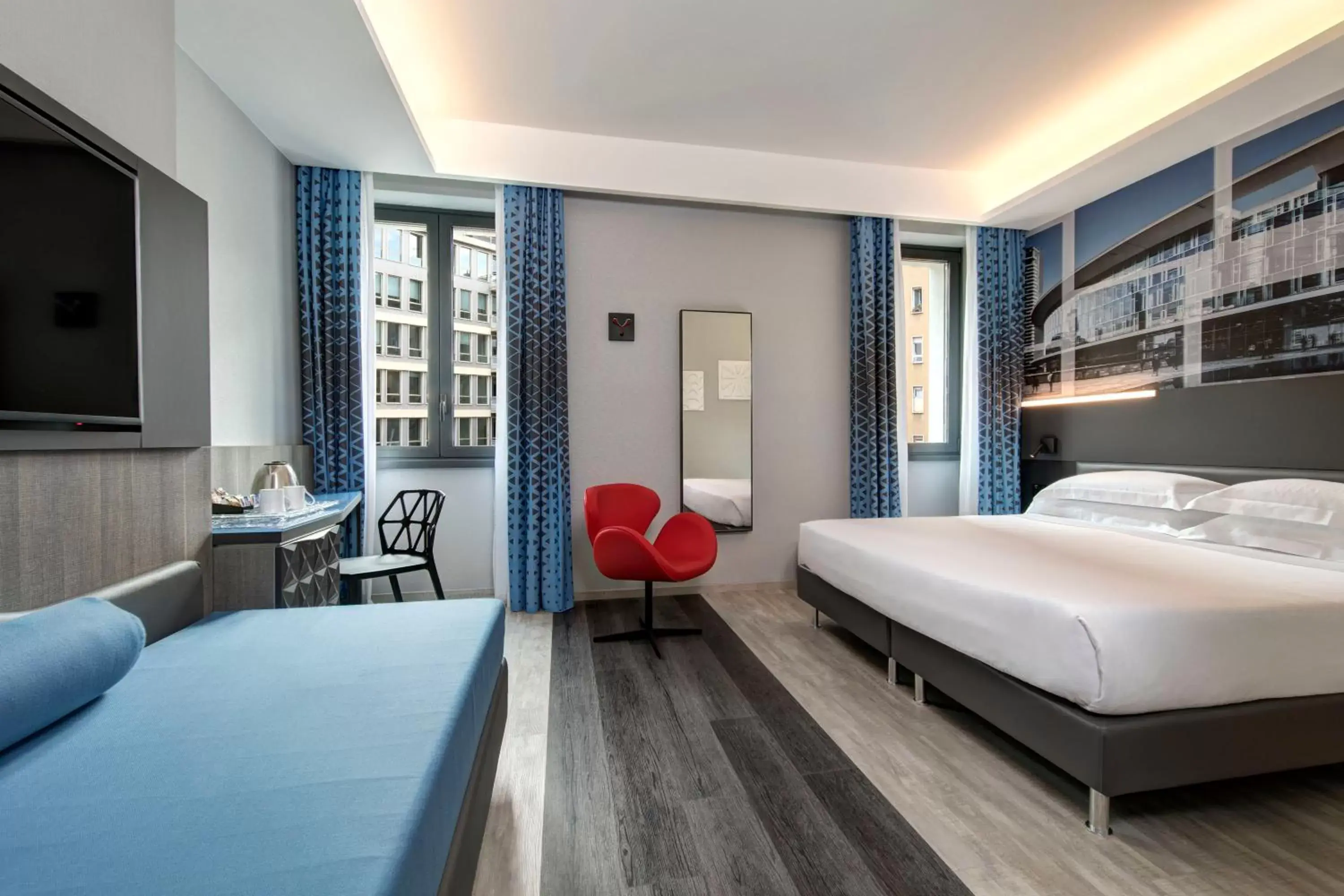 Bed in iQ Hotel Milano