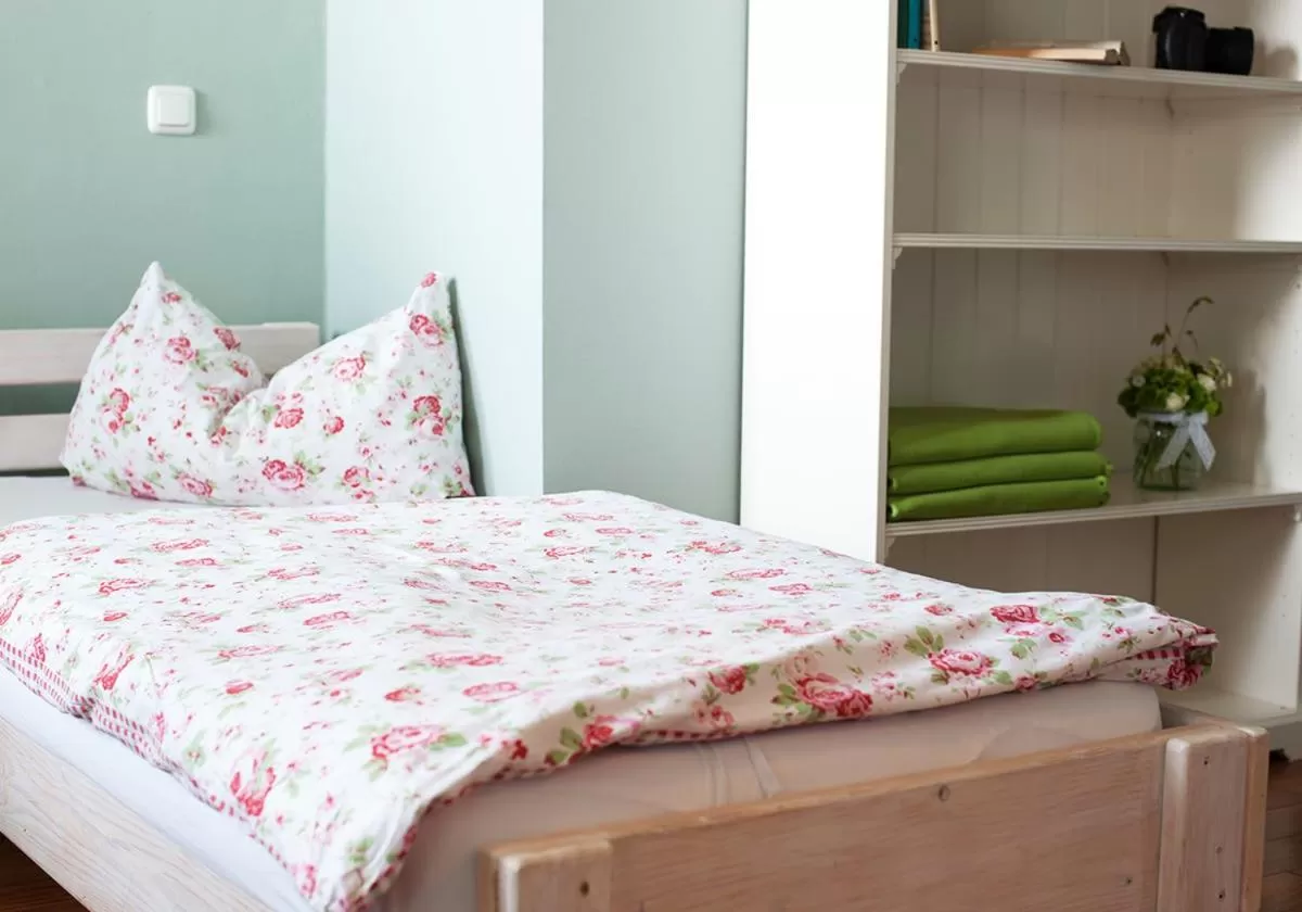 Bed in WELTRAD Am Fluß Restaurant & Quartier