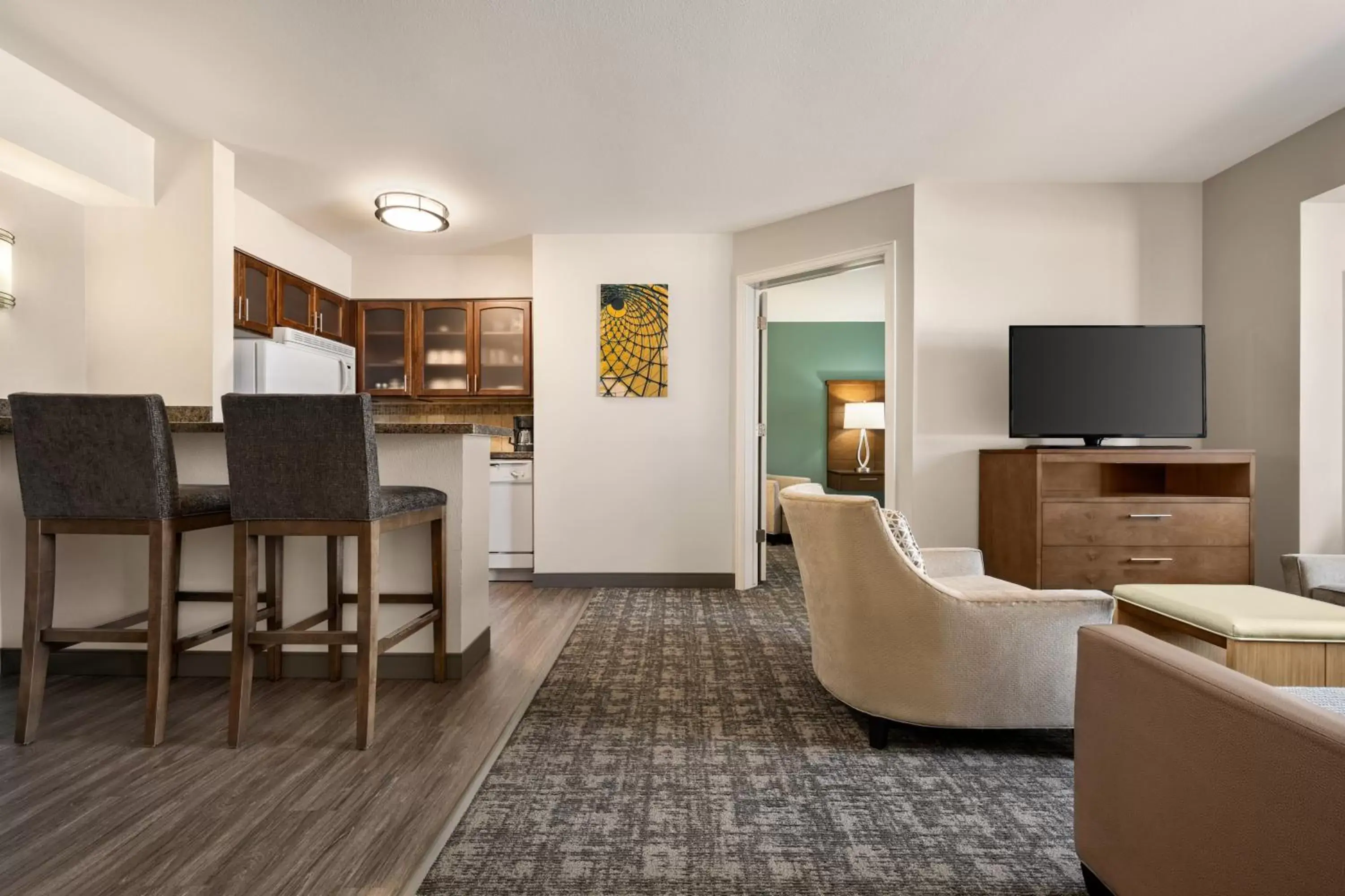 Living room, Seating Area in Staybridge Suites Oklahoma City-Quail Springs, an IHG Hotel