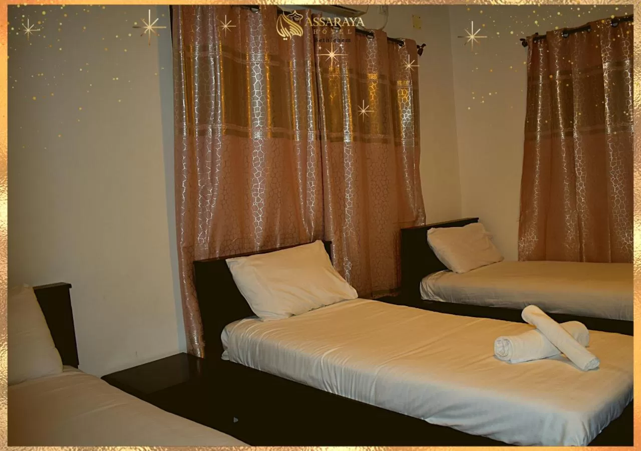 Bed in Assaraya Palace Hotel