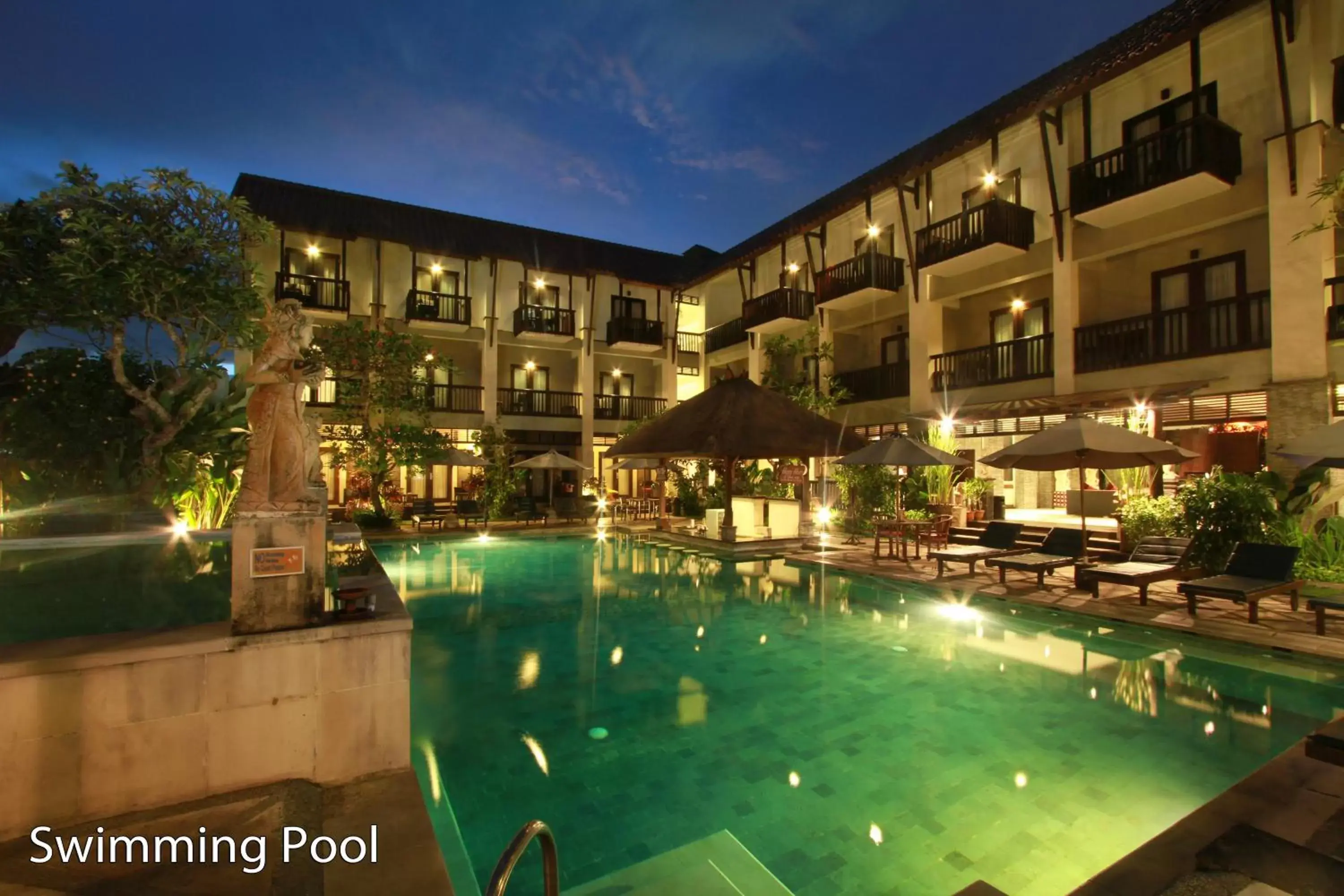 Swimming pool, Property Building in The Lokha Legian Resort & Spa