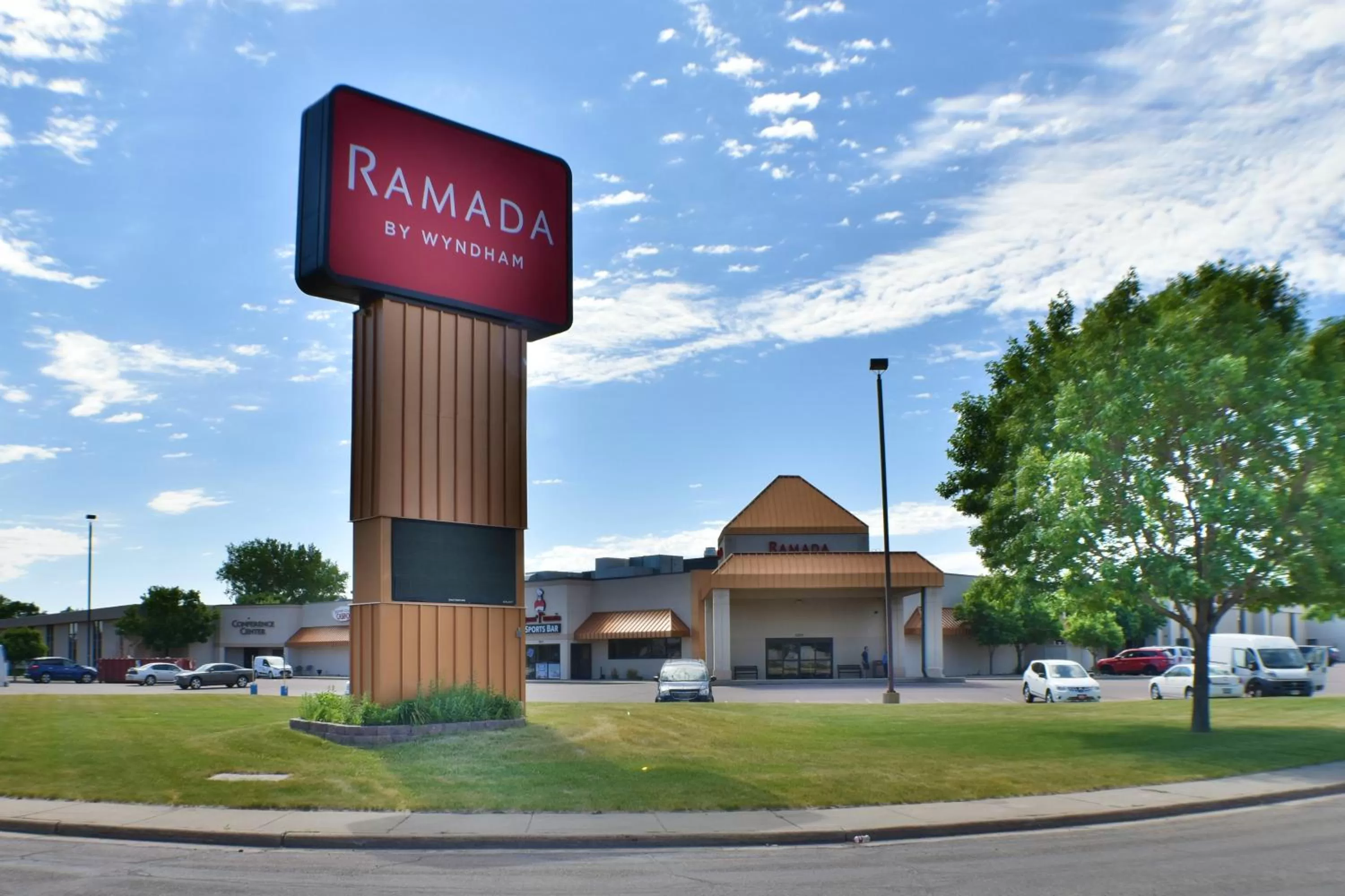 Property logo or sign in Ramada by Wyndham Sioux Falls Airport - Waterpark Resort & Event Center