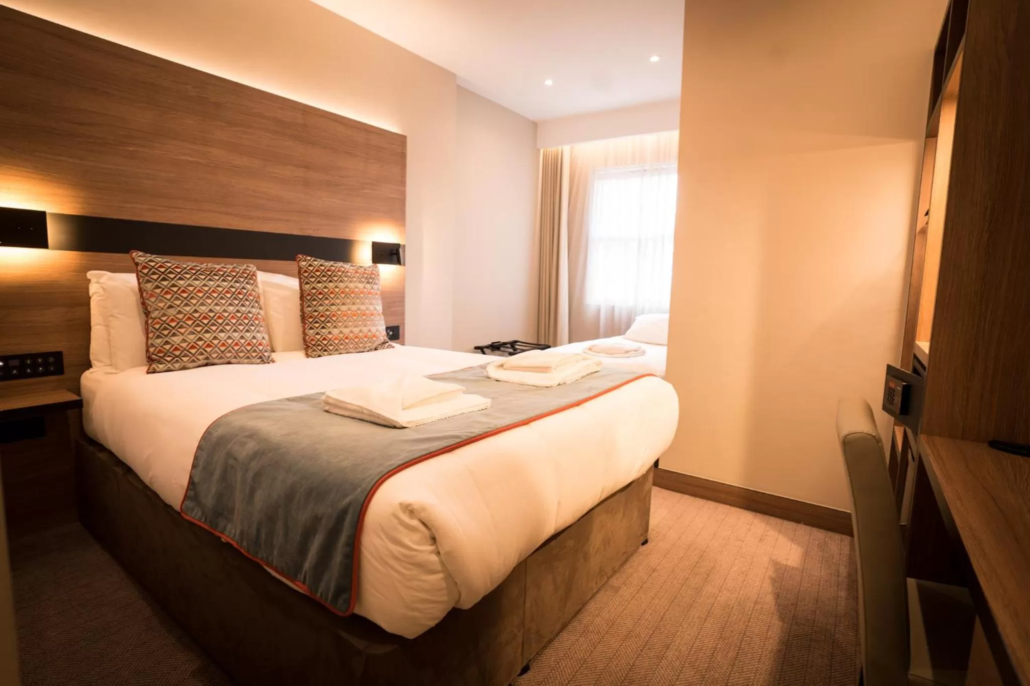 Bed in Merit Kensington Hotel