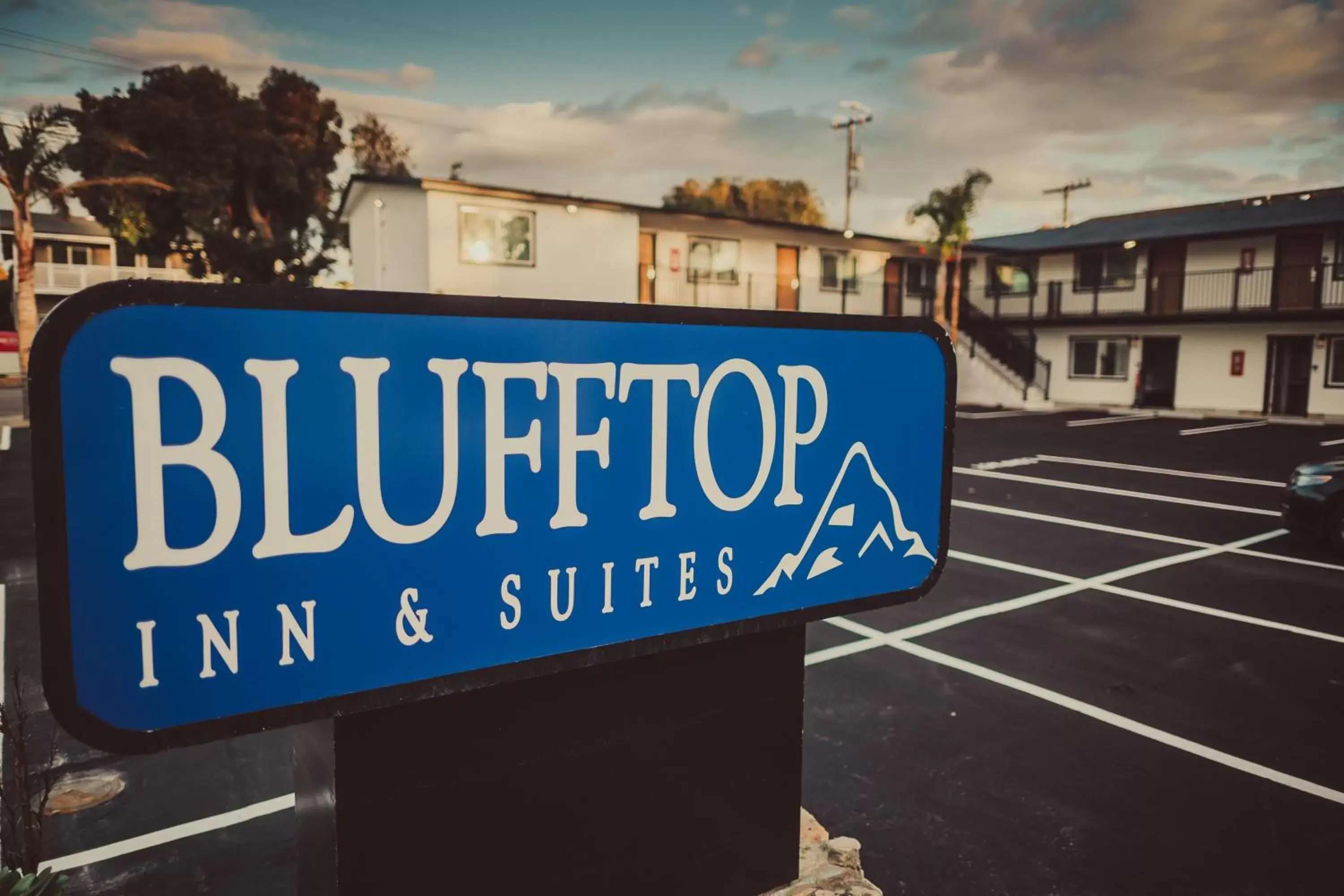 Property logo or sign in Blufftop Inn & Suites - Wharf/Restaurant District
