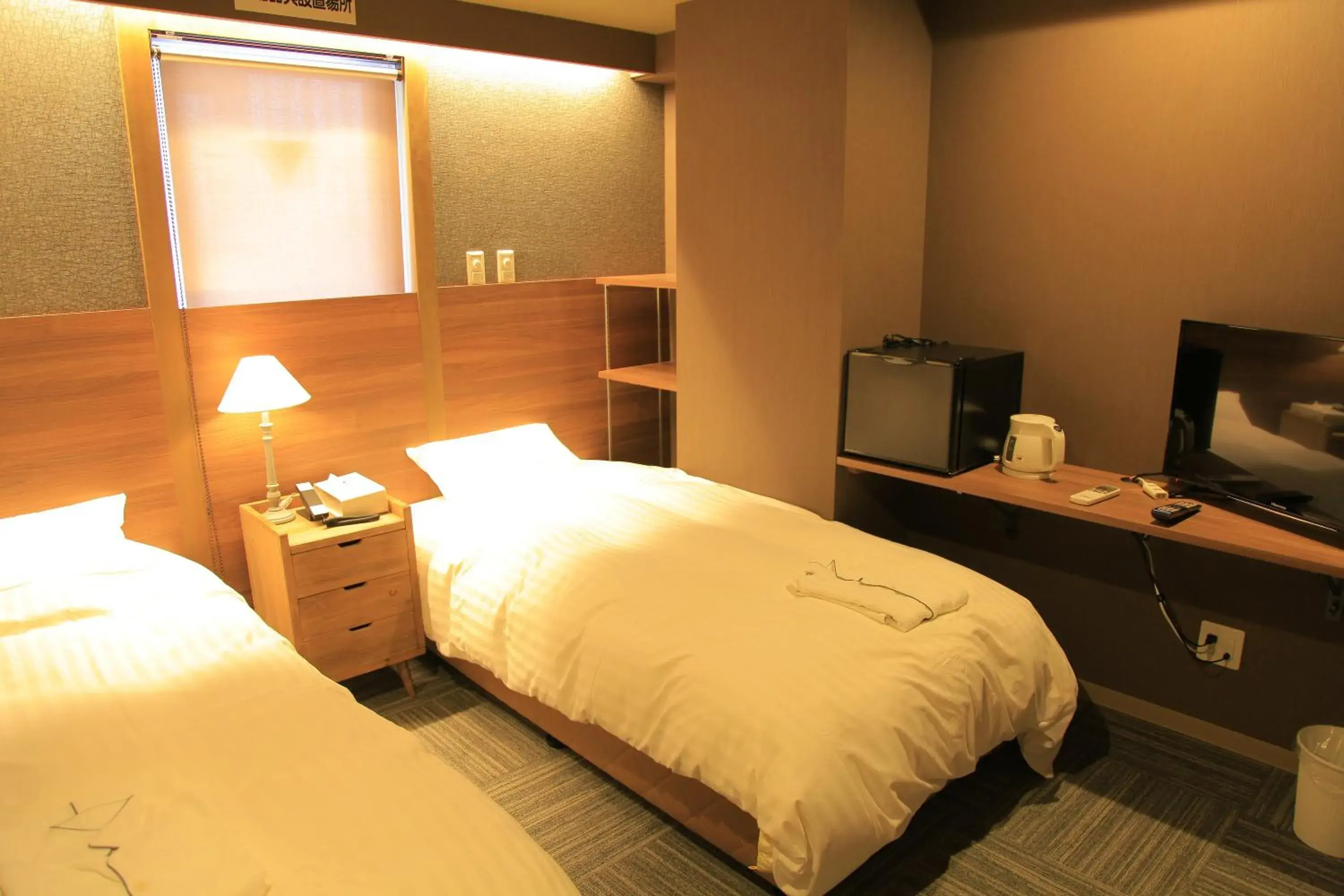 Bed in Ryuka Hotel Naha