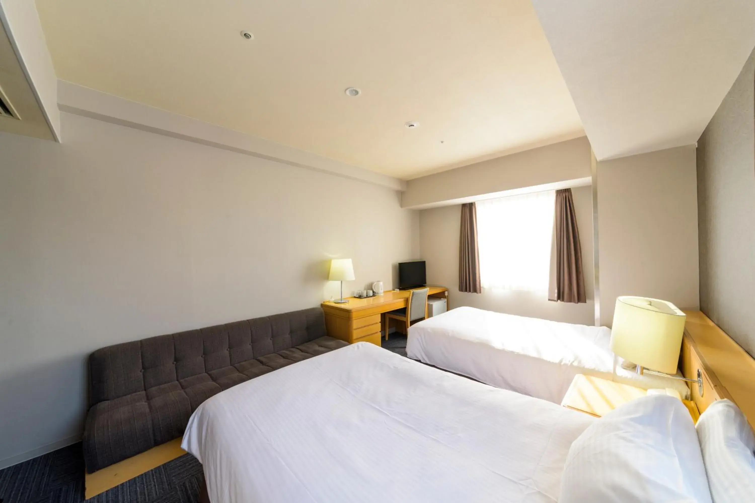 Bed in SureStay Plus Hotel by Best Western Shin-Osaka