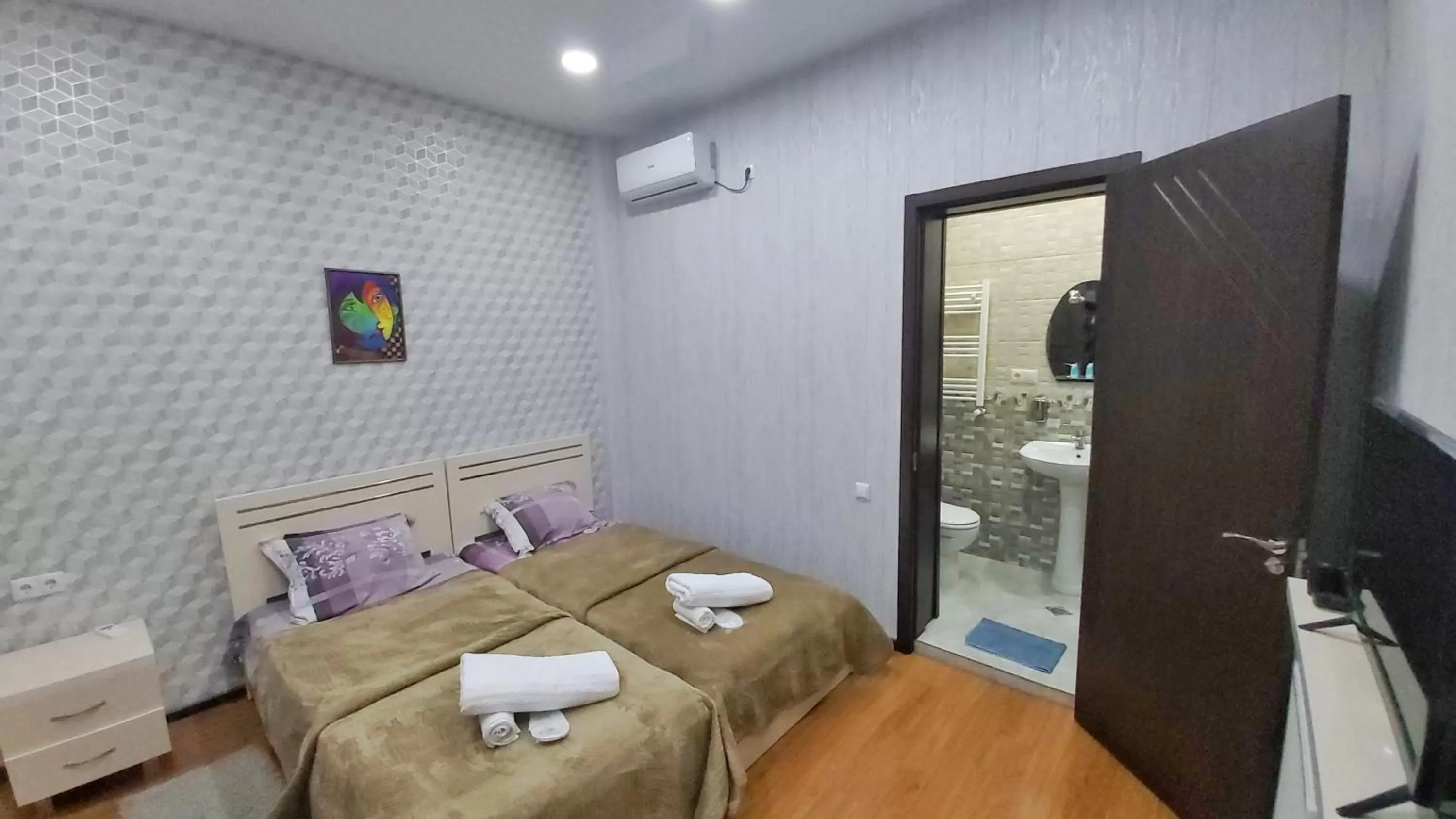 Bed in Gamarjoba Hotel