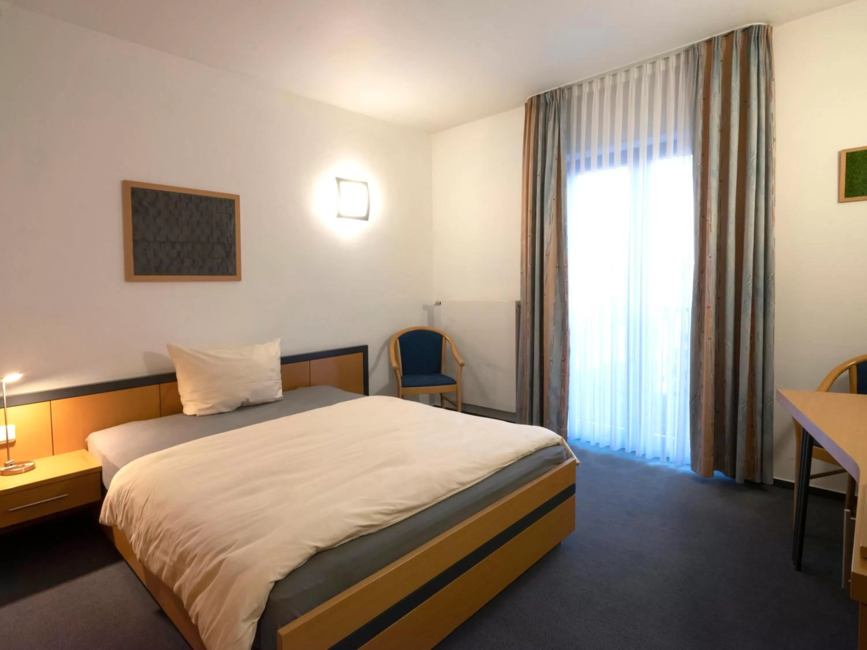 Photo of the whole room, Bed in Hotel am Stadtpark