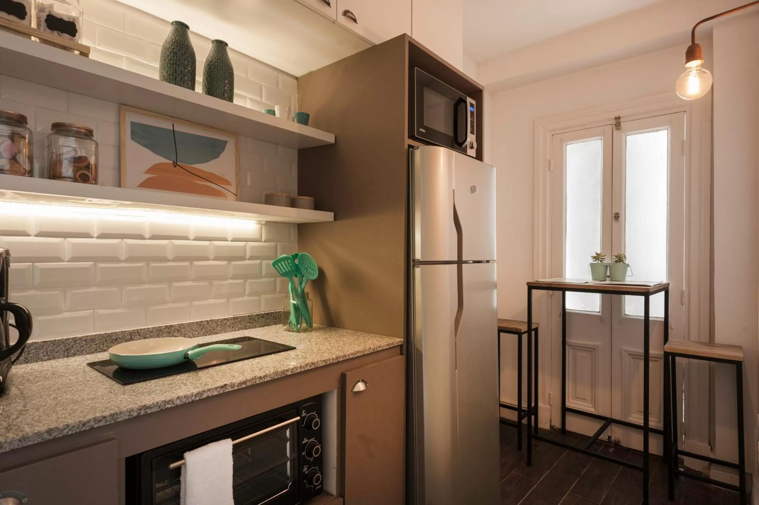 Communal kitchen in San Telmo Suites