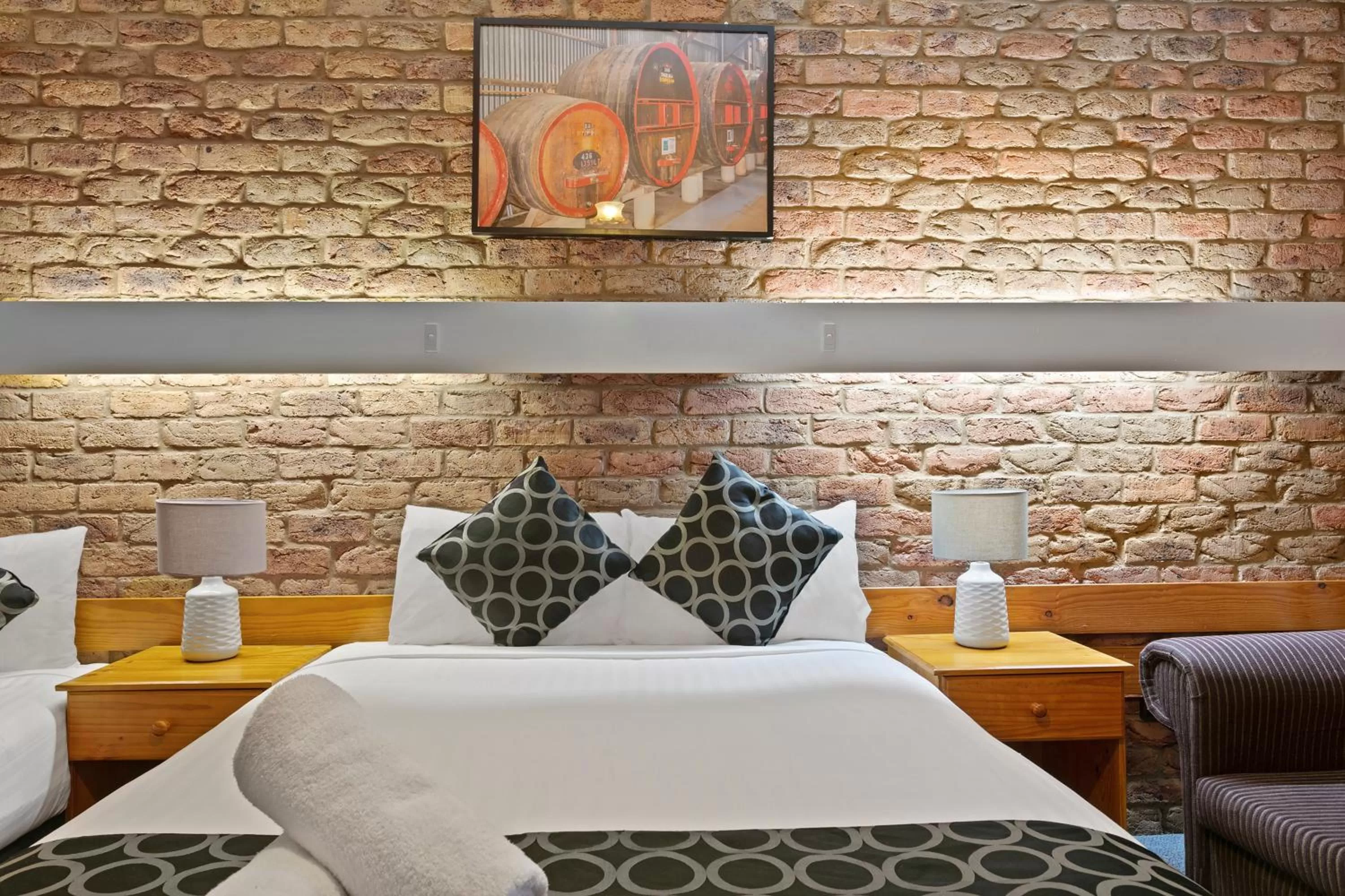 Bed in The Settlement Historic Hotel