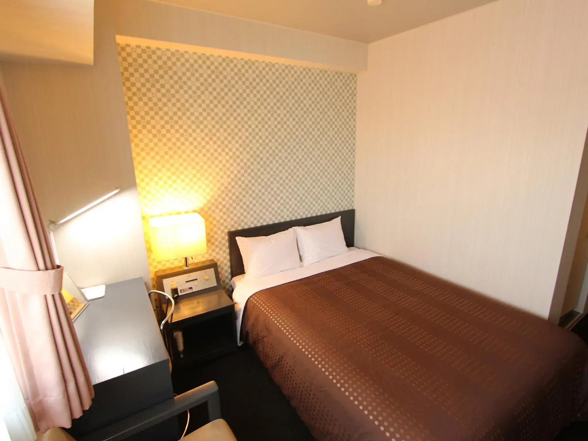 Bed in HOTEL LiVEMAX BUDGET Chitose