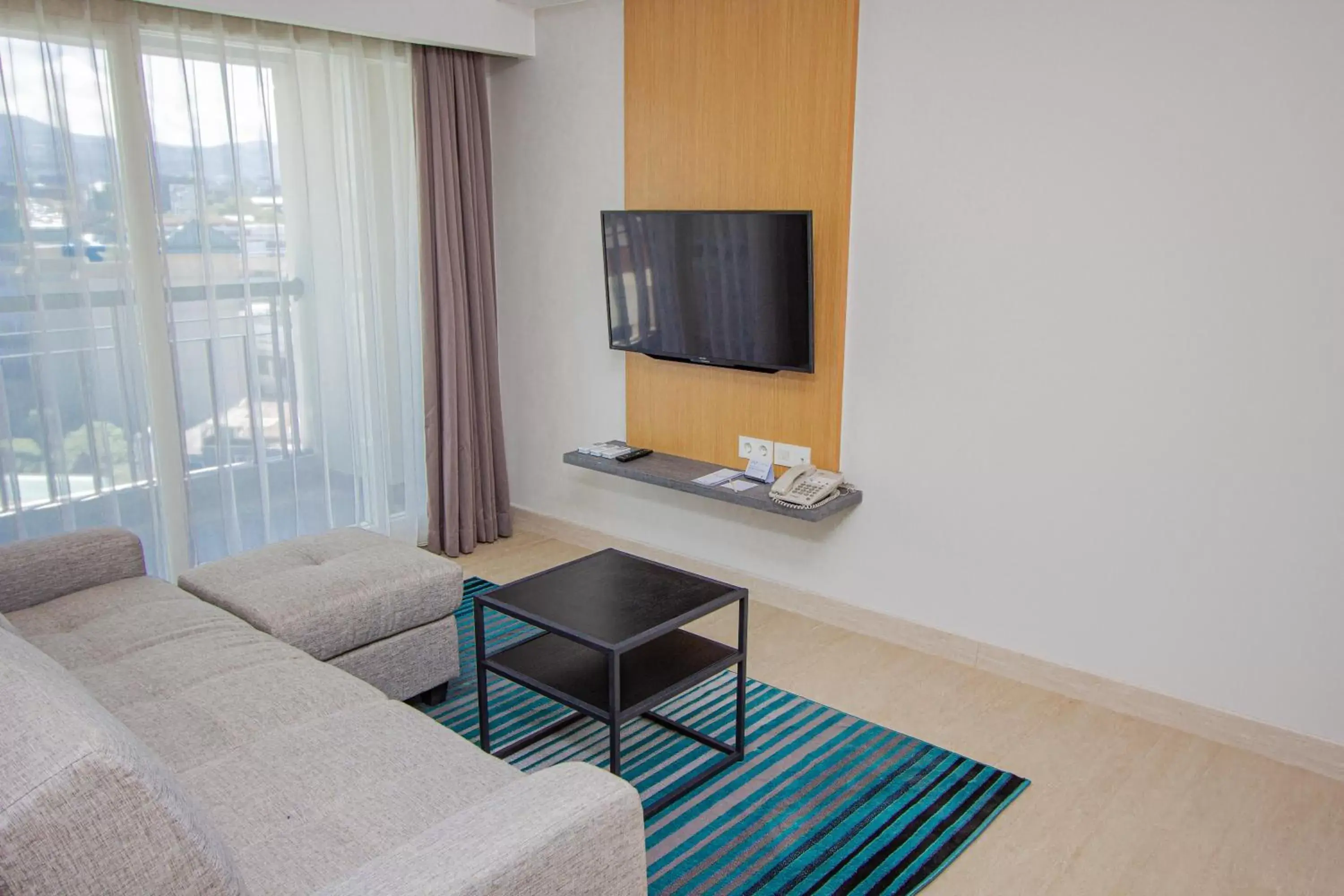 Seating area, TV/Entertainment Center in Grand Dafam Braga Bandung