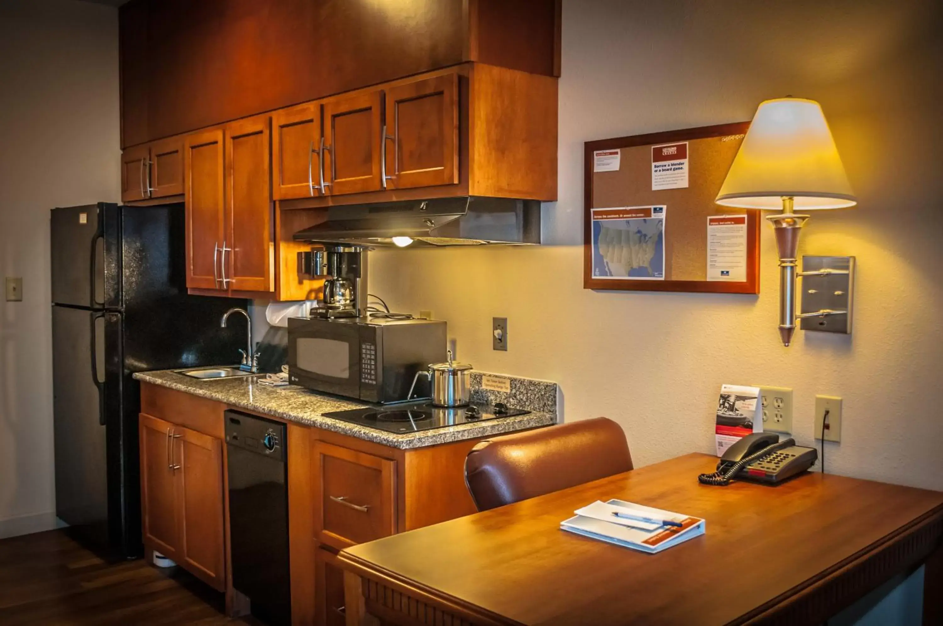 Bedroom, Kitchen/Kitchenette in Candlewood Suites New Iberia, an IHG Hotel