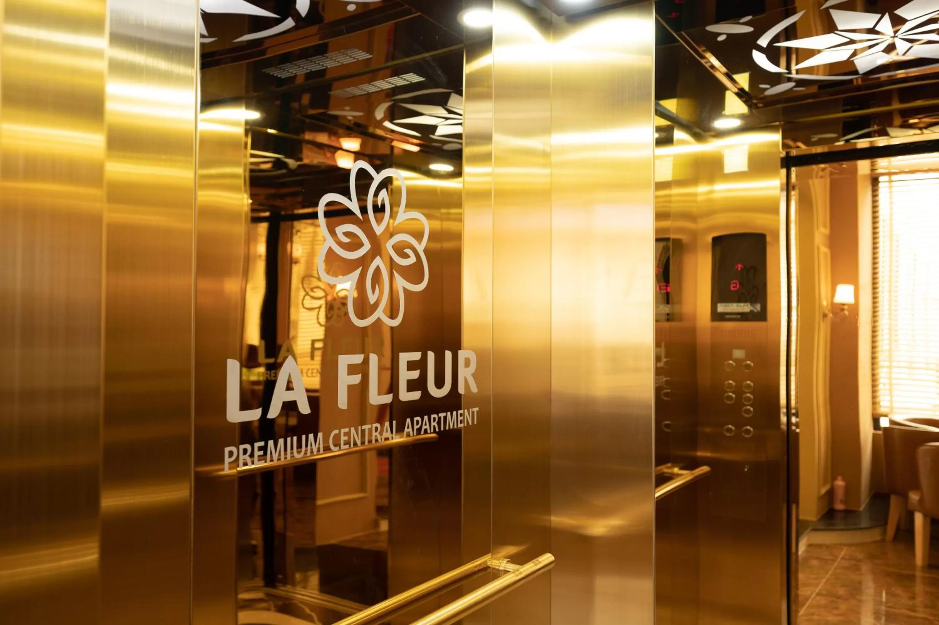 Property logo or sign in La Fleur Premium Central Apartment Hotel
