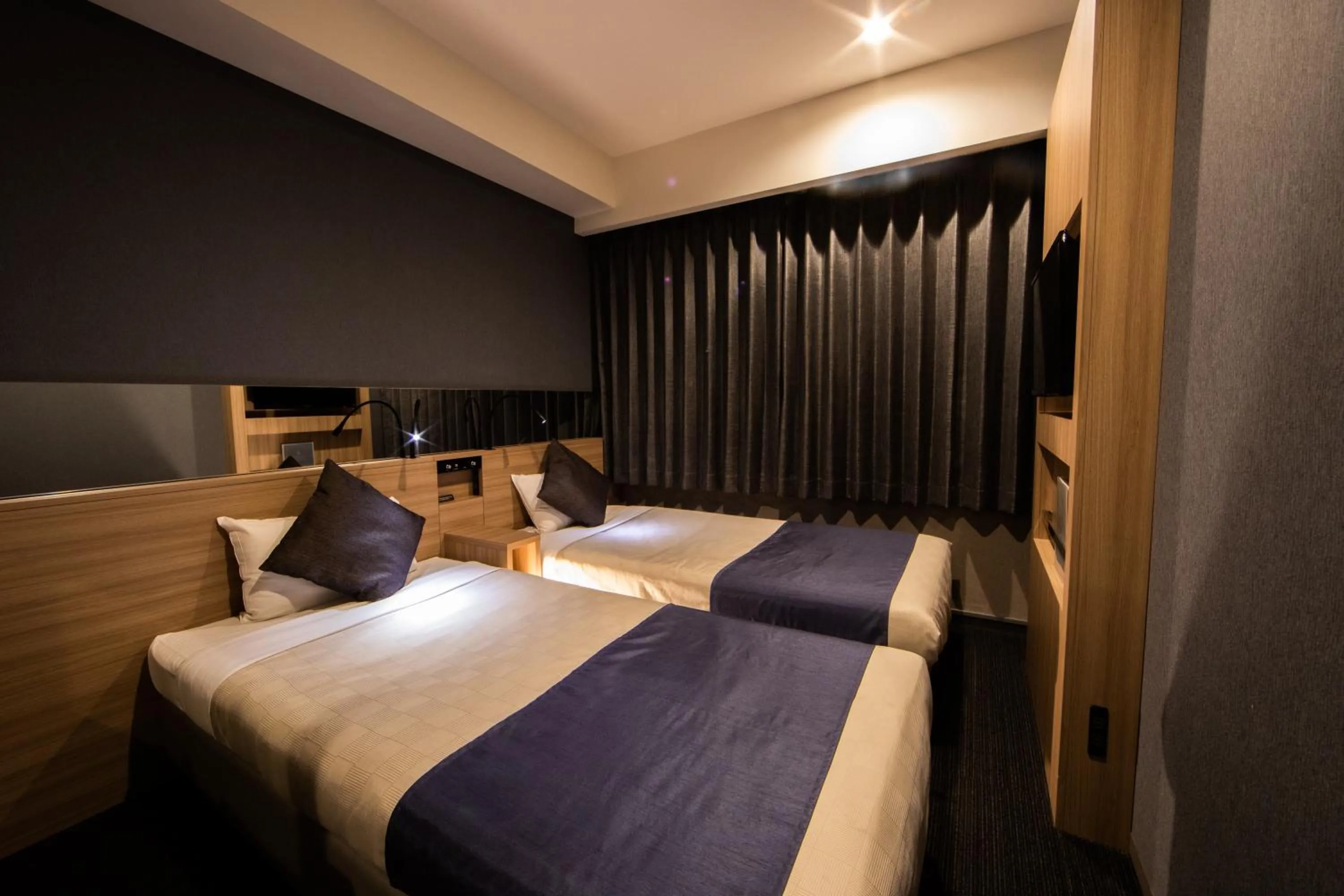 Photo of the whole room, Bed in Quintessa Hotel Osaka Shinsaibashi Comic & Books