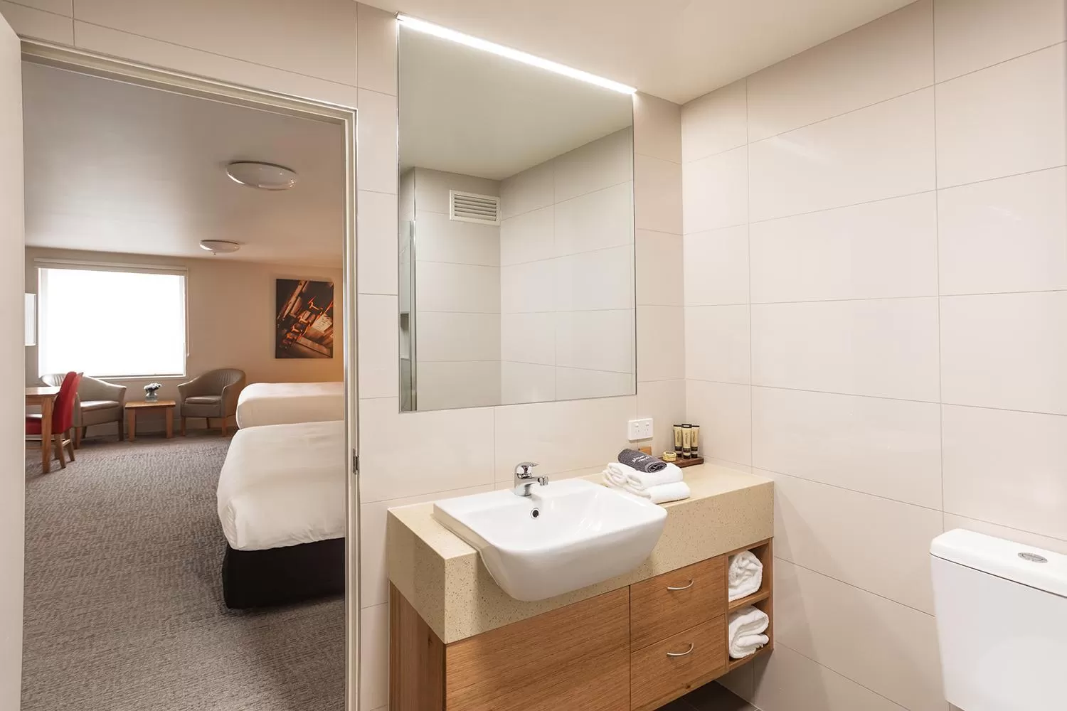 Bathroom, Bed in The Old Woolstore Apartment Hotel